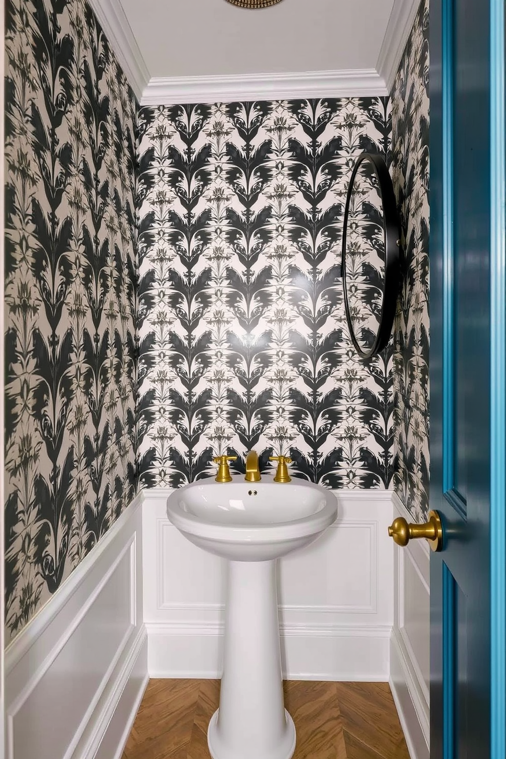 A sleek floating vanity with a stylish sink is the centerpiece of this small powder room. The walls are adorned with elegant wallpaper featuring a subtle pattern, and the floor is finished with chic, dark tiles. Above the vanity, a round mirror with a modern frame reflects the ambient lighting from a stylish wall sconce. Decorative elements include a small potted plant and a neatly folded towel placed on the vanity for a touch of luxury.