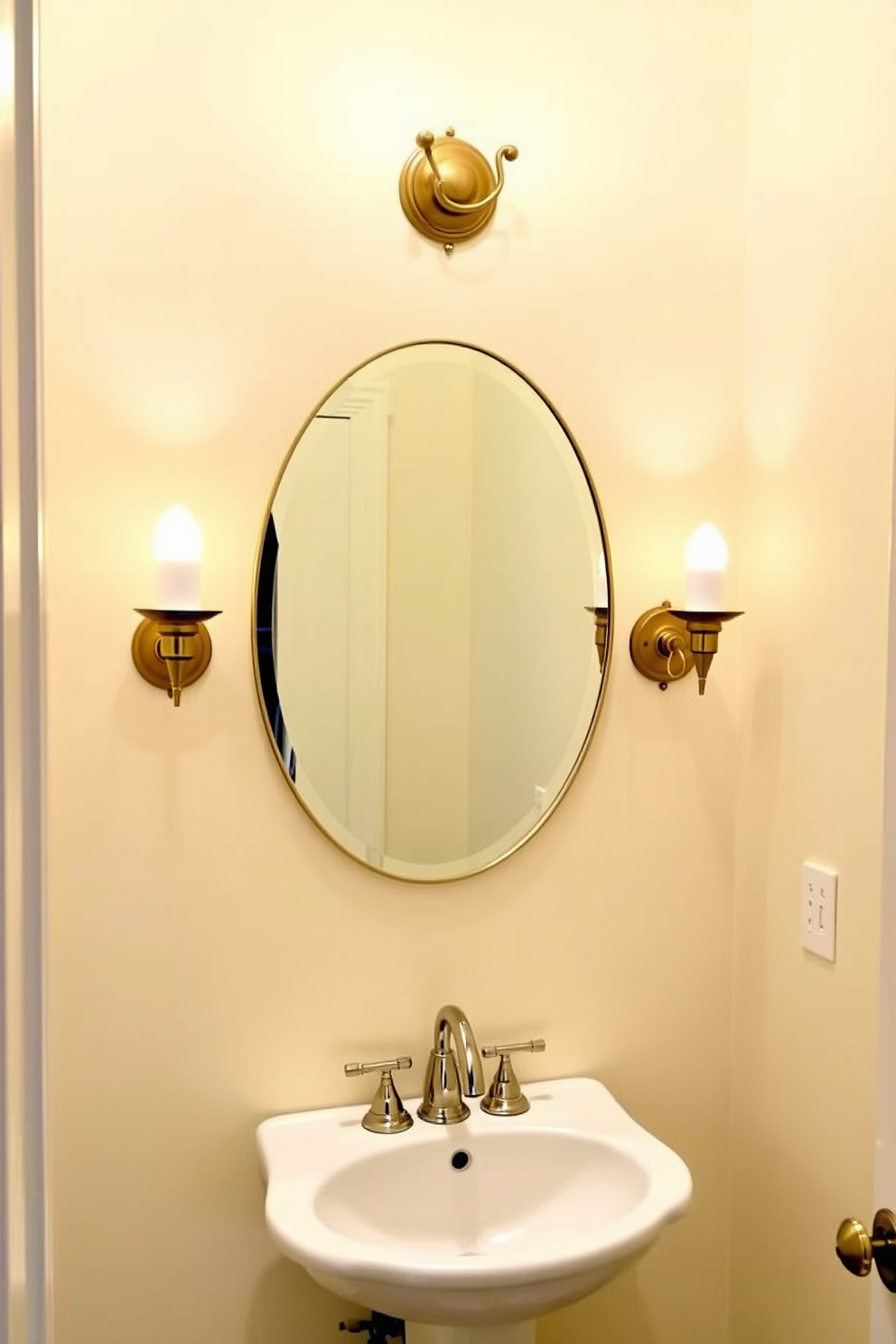 A small powder room features elegant sconce lighting on either side of a round mirror. The walls are painted in a soft pastel hue, and a compact vanity with a white sink is placed beneath the mirror.