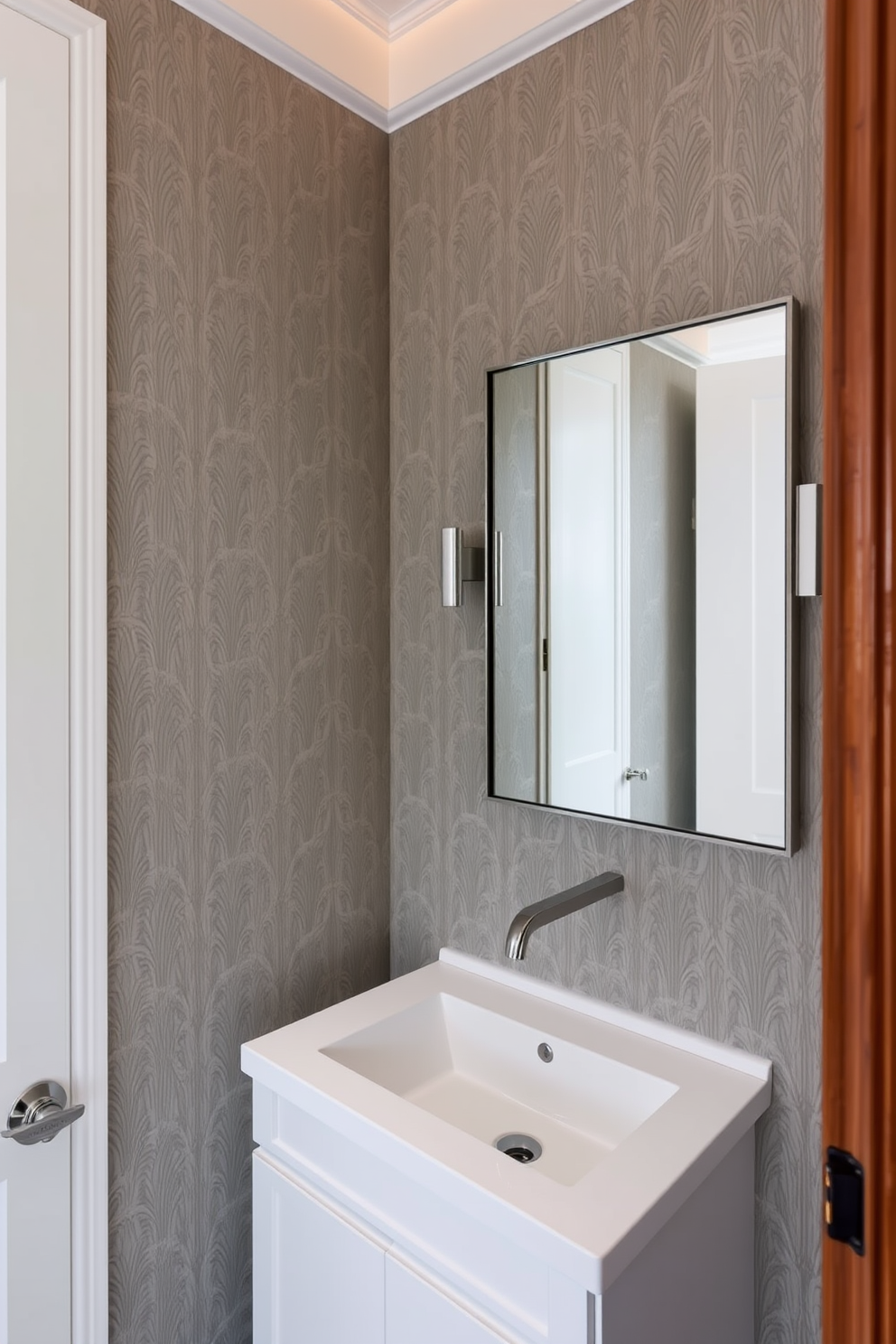 A small powder room features a wall-mounted faucet that enhances the sleek and modern aesthetic. The walls are adorned with elegant wallpaper in a subtle pattern, and a compact vanity with a polished countertop provides functionality without sacrificing style.