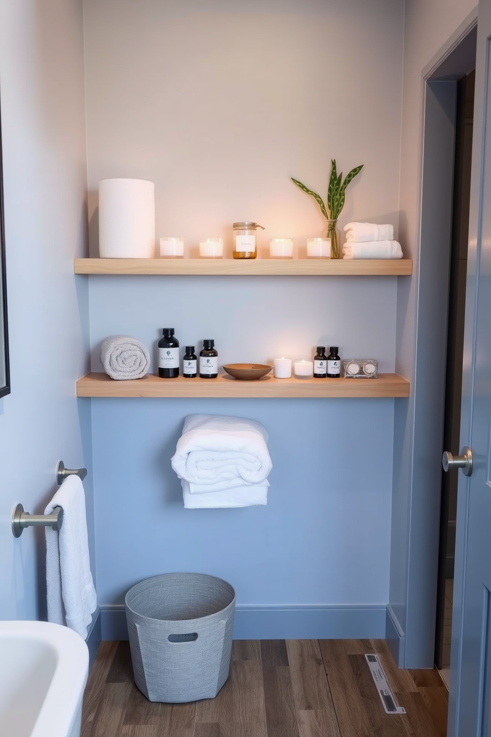 A serene small spa bathroom featuring floating shelves elegantly arranged with spa essentials such as scented candles, essential oils, and plush towels. The walls are painted in a calming light blue, and the floor is adorned with natural wood tiles, creating a tranquil atmosphere.