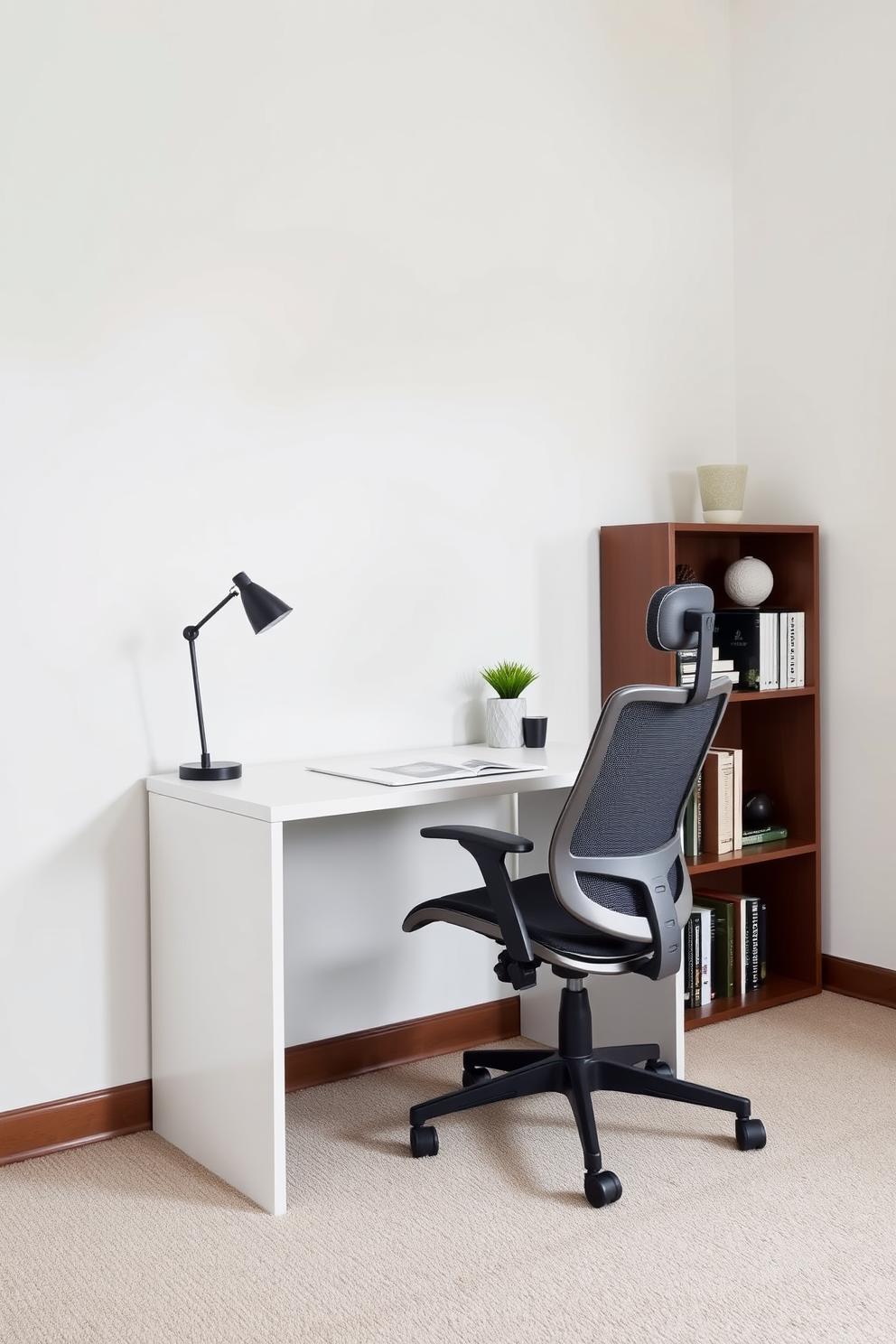 A compact desk is positioned against the wall, featuring clean lines and a sleek finish. An ergonomic chair with lumbar support complements the desk, creating a comfortable workspace. The walls are painted in a soft neutral tone, enhancing the sense of space and tranquility. A small bookshelf filled with neatly organized books and decorative items adds a personal touch to the room.