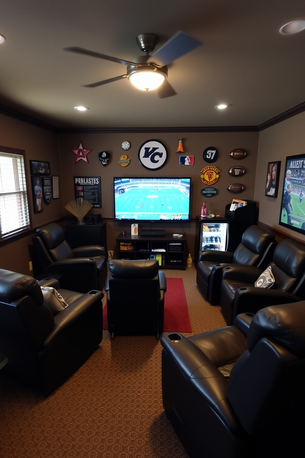 A cozy sports man cave featuring comfortable recliners arranged in a semi-circle around a large flat-screen TV. The walls are adorned with sports memorabilia, and a mini-fridge stocked with snacks and drinks is conveniently placed nearby.