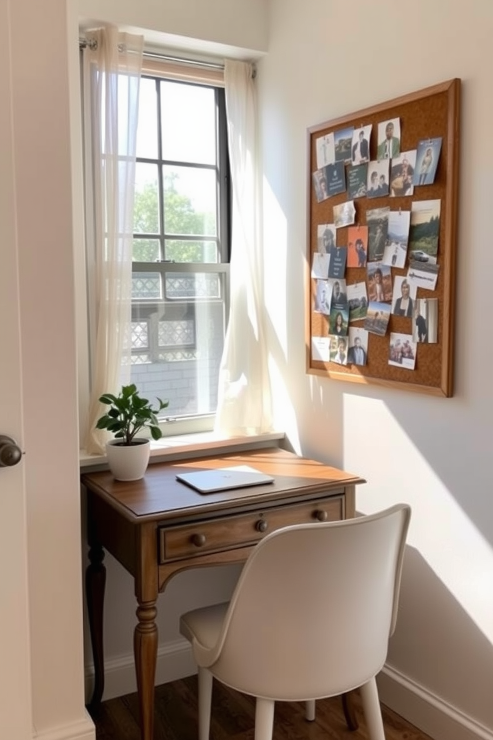 Create a small workspace with charm. The room features a vintage wooden desk with a sleek white chair and a small potted plant on the corner. Natural light floods through a window adorned with sheer curtains. The walls are painted in a soft pastel color, and a corkboard filled with inspiring images hangs above the desk.