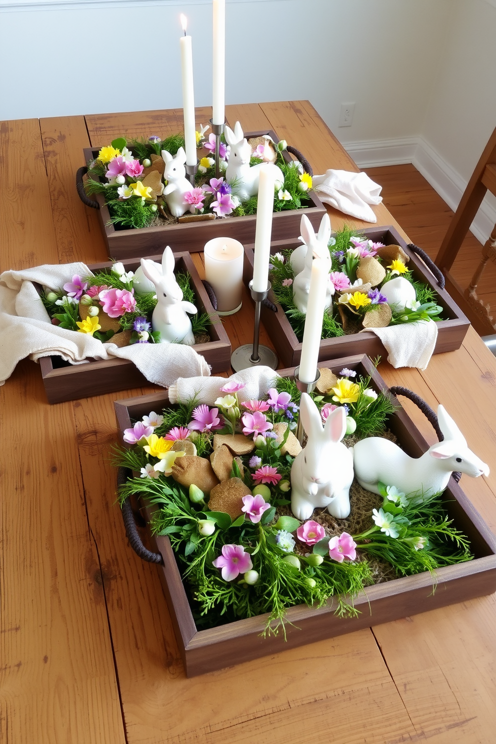 Decorative trays adorned with vibrant spring-themed decor are arranged on a rustic wooden table. Each tray features an assortment of pastel-colored flowers, small ceramic bunnies, and fresh greenery to evoke the essence of the season. The trays are complemented by soft, textured fabrics in light hues, enhancing the overall spring ambiance. Delicate candles in various heights are placed strategically among the decor, casting a warm and inviting glow.