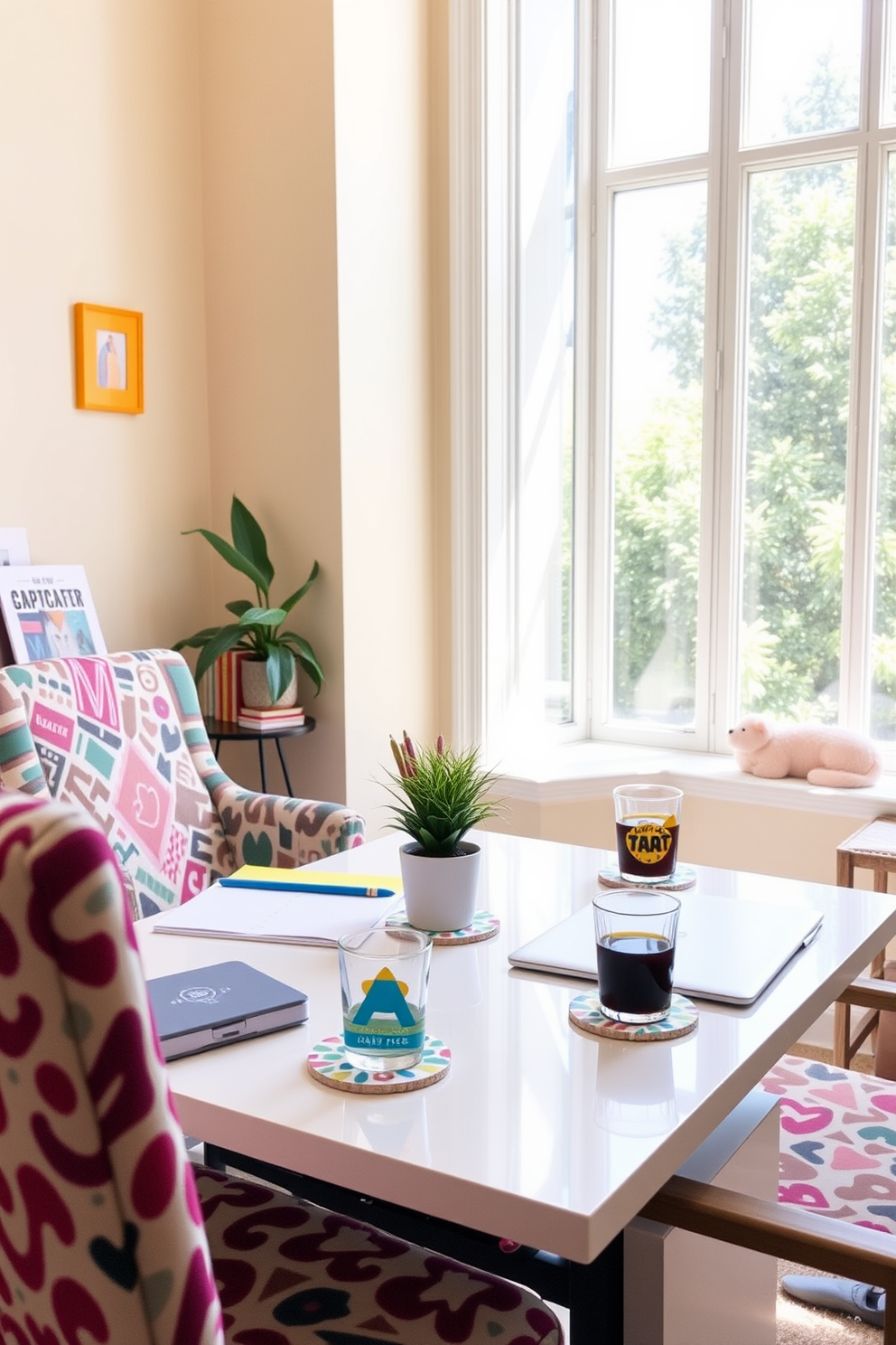 A bright and cheerful home office featuring playful coasters for drinks. The desk is adorned with colorful stationery and a small potted plant, creating an inviting workspace. The walls are painted in a soft pastel hue, complemented by a cozy armchair in a bold pattern. Natural light pours in through a large window, illuminating the space and enhancing the vibrant decor.