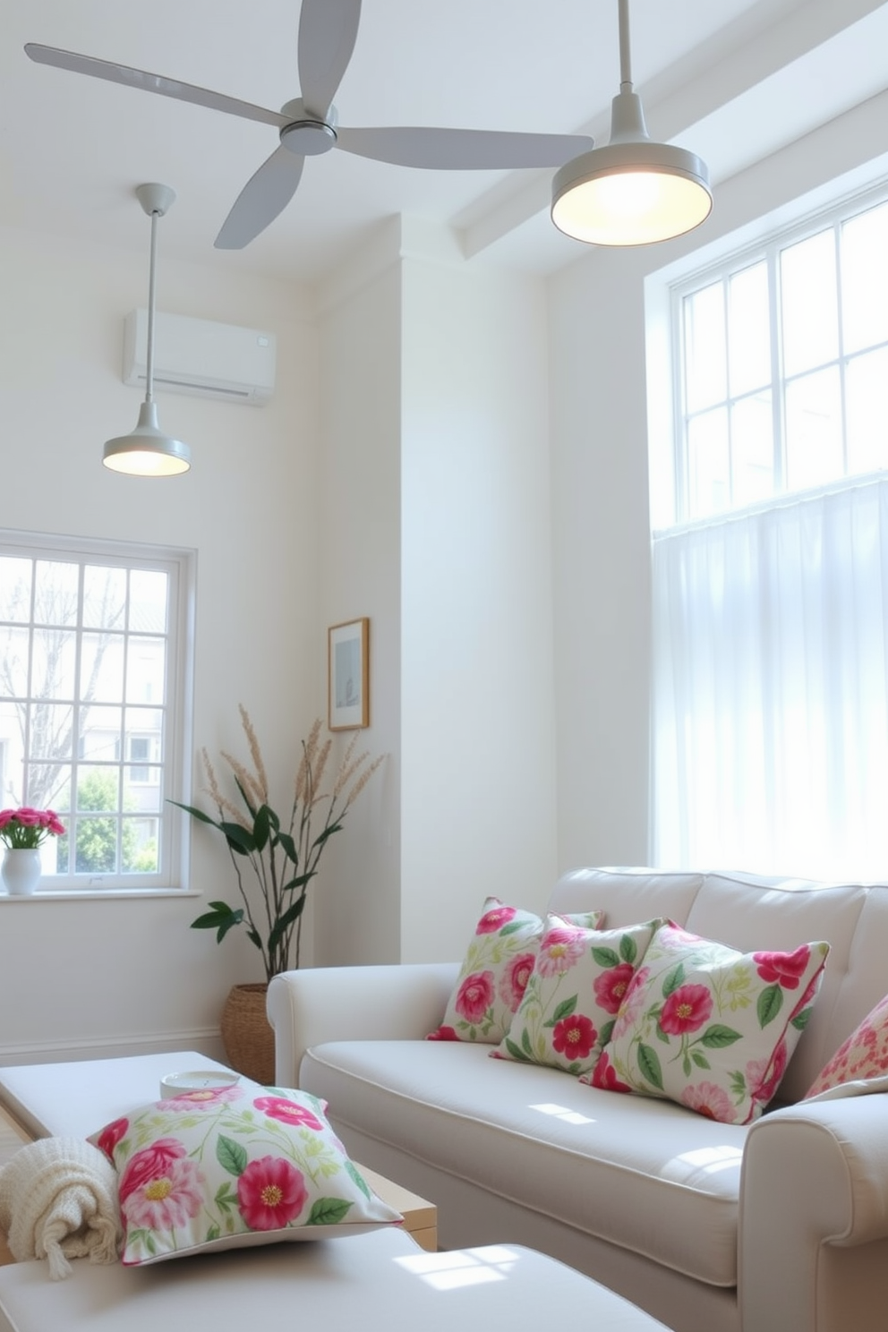 A bright and airy living room filled with natural light. The updated light fixtures are modern and sleek, illuminating the space with a warm glow. The walls are painted in a soft pastel color, creating a fresh and inviting atmosphere. A mix of vibrant spring-themed decor, including floral cushions and a light throw blanket, adds a cheerful touch to the room.