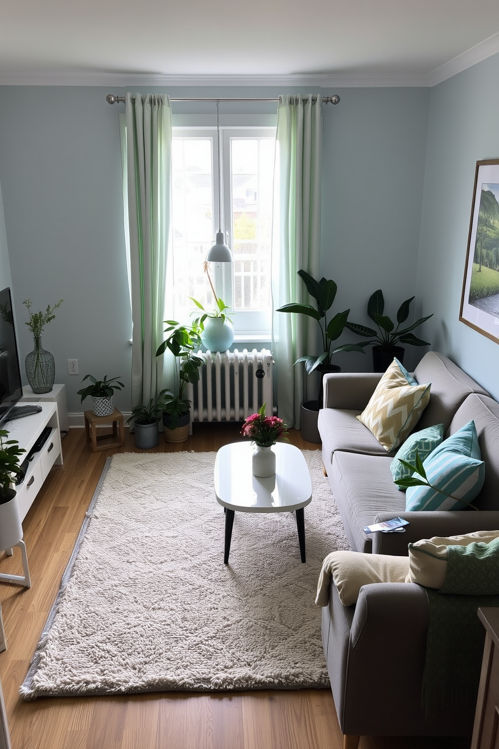 A small living room decorated in soft blue and green tones. Cozy furniture pieces are arranged to create an inviting atmosphere, with light curtains allowing natural light to filter in. A plush area rug in a subtle pattern anchors the space, while decorative pillows add a pop of color to the seating. Potted plants are strategically placed to bring a touch of spring indoors, enhancing the fresh and airy feel.