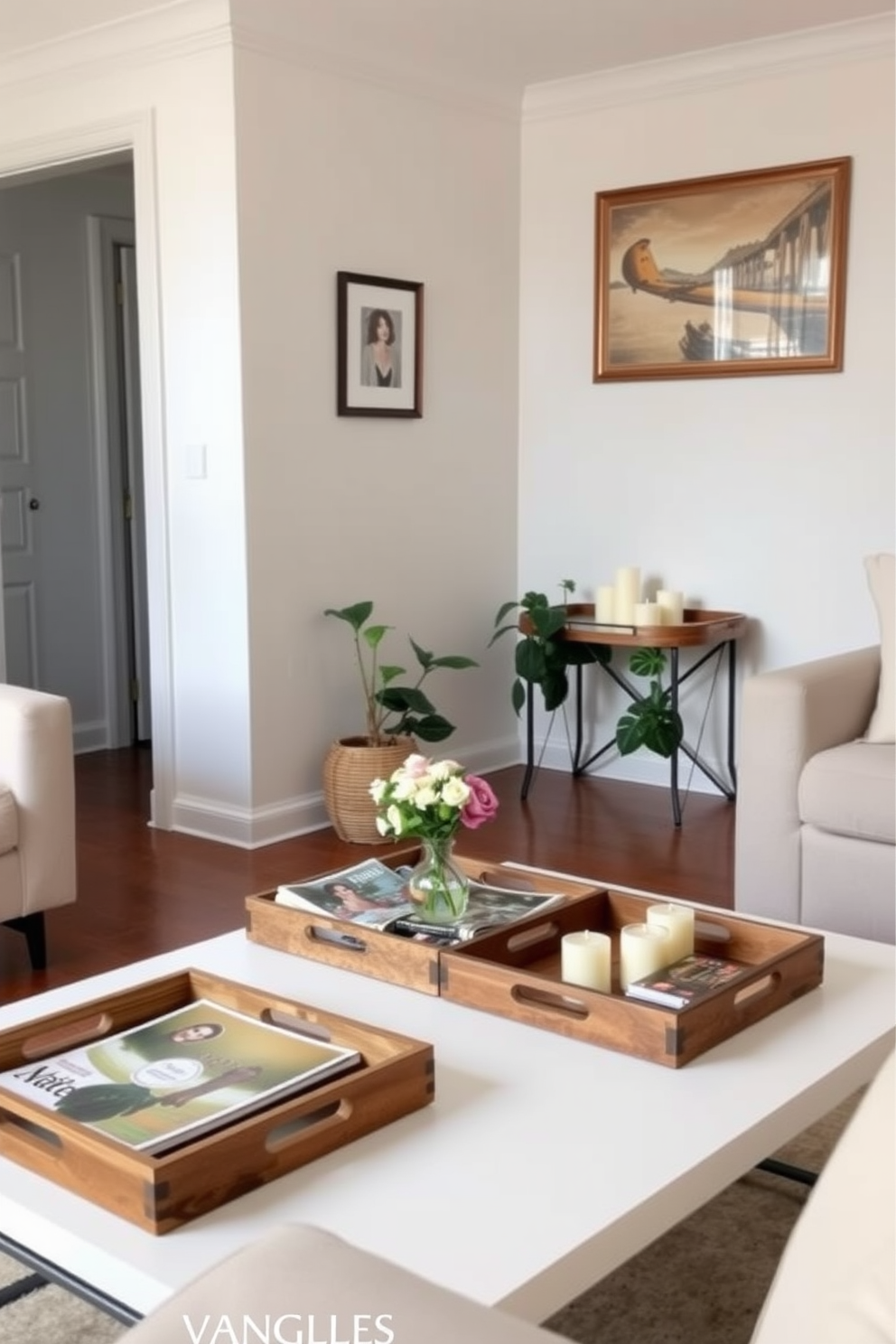 A bright and airy living room features decorative trays arranged on a coffee table to hold magazines and coasters. The walls are painted in soft pastel colors, and a few potted plants add a touch of greenery to the small space. A cozy corner nook showcases a decorative tray filled with candles and a small vase of fresh flowers. The furniture is minimal yet stylish, allowing for easy movement while maintaining an inviting atmosphere.