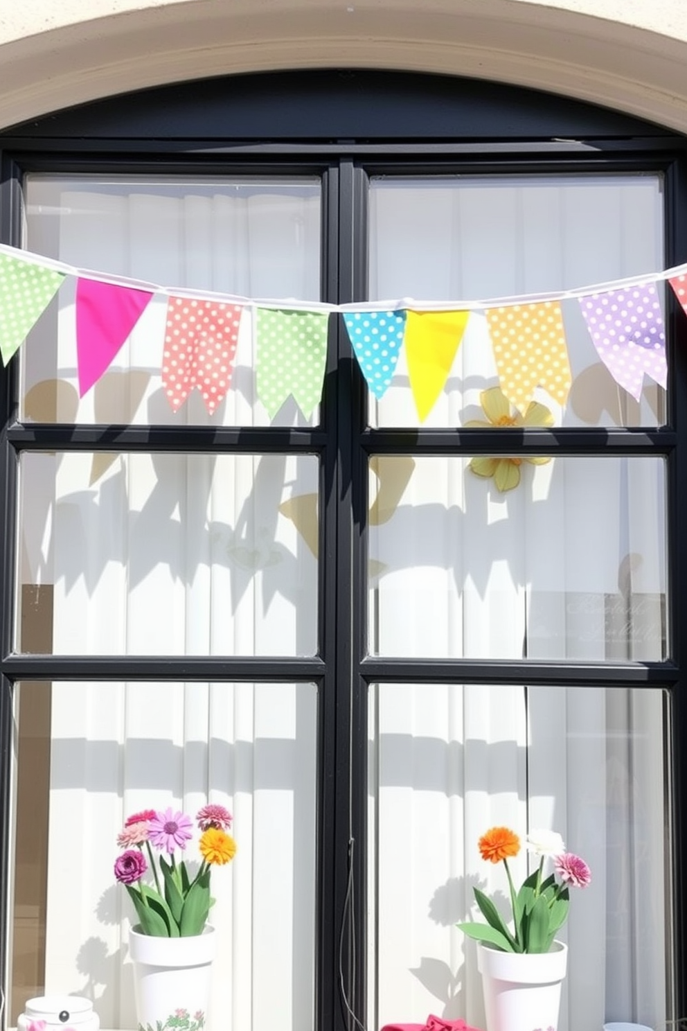 A bright and cheerful window display adorned with colorful bunting strung across the top. The bunting features a variety of vibrant colors and patterns, adding a festive touch to the spring decor.