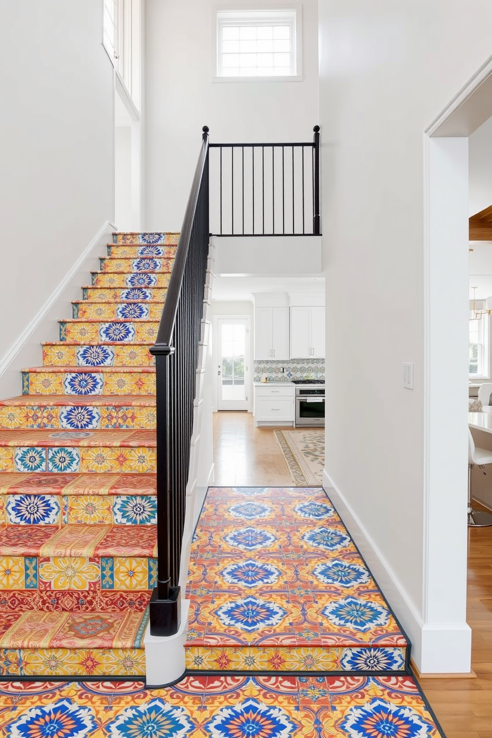 A stunning staircase with colorful tile risers that create a vibrant visual impact. The risers feature a mix of intricate patterns in blue, yellow, and red, while the surrounding walls are painted in a crisp white to enhance the colors. An open-concept kitchen design that flows seamlessly into the staircase area. The kitchen boasts sleek cabinetry, a large island with bar seating, and modern appliances, all complemented by the lively tile risers of the staircase nearby.