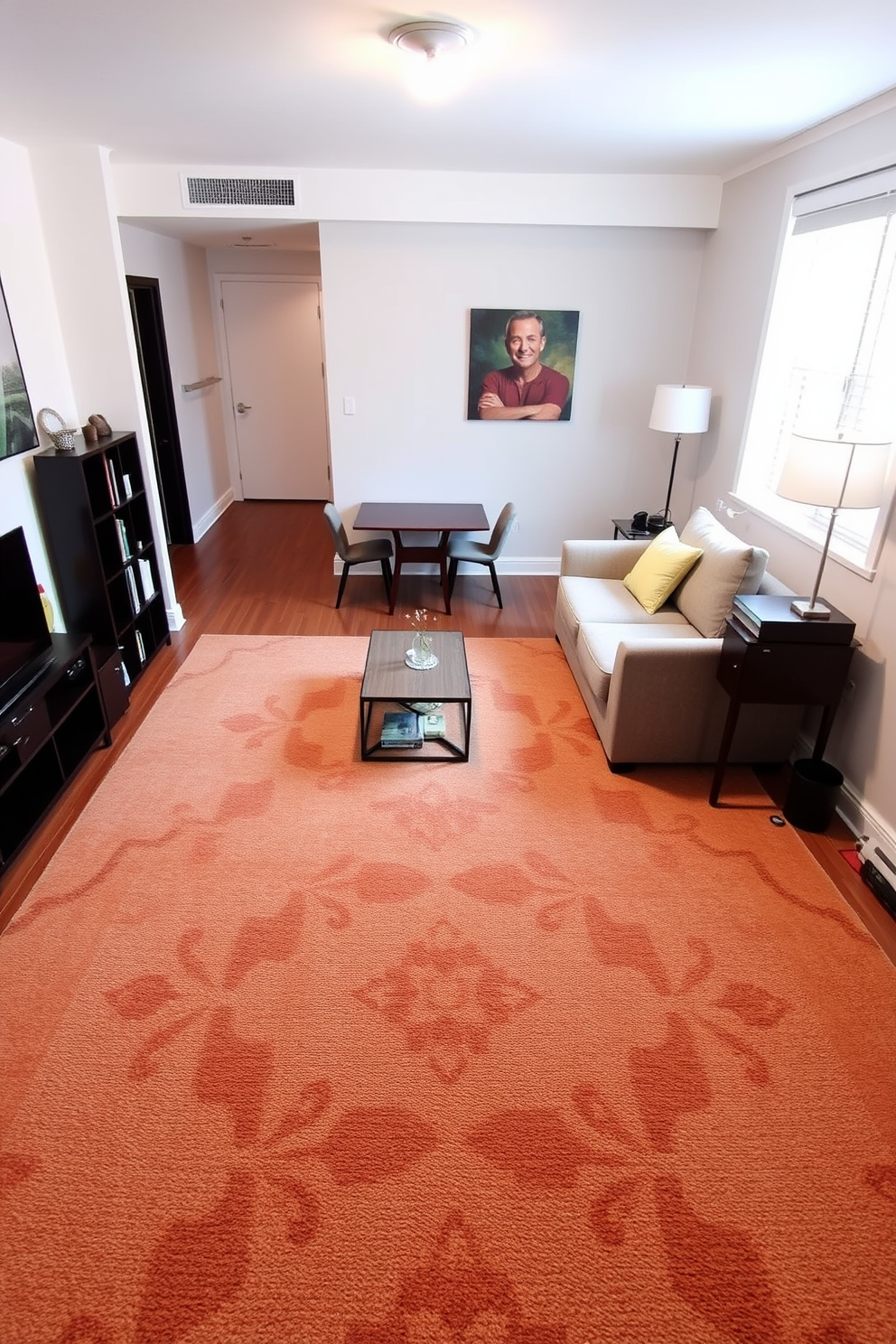 A cozy studio apartment featuring a large area rug that brings together the living and sleeping areas. The rug is adorned with a geometric pattern in warm tones, creating a welcoming atmosphere. The living area includes a plush sofa facing a stylish coffee table, while a small bookshelf adds character to the space. Nearby, a compact dining table with two chairs complements the open layout, enhancing functionality without sacrificing style.