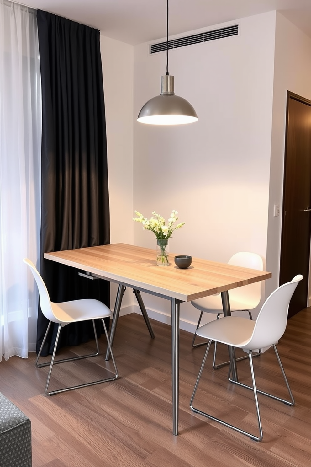 A stylish studio apartment features a foldable dining table that elegantly blends functionality and aesthetics. The table is made of light wood with sleek metal legs, allowing it to be easily expanded or tucked away when not in use. Surrounding the table are modern chairs that complement its design, providing comfort without sacrificing space. The dining area is illuminated by a contemporary pendant light that adds a warm ambiance to the cozy setting.