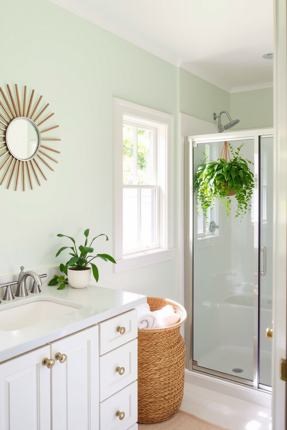 A bright and airy summer bathroom featuring a sunburst mirror that reflects natural light. The walls are painted in a soft pastel hue, complemented by white cabinetry and a spacious shower with glass doors. Incorporate plants for a fresh touch, with a hanging potted fern near the window. A woven basket holds fluffy towels, adding texture and warmth to the space.