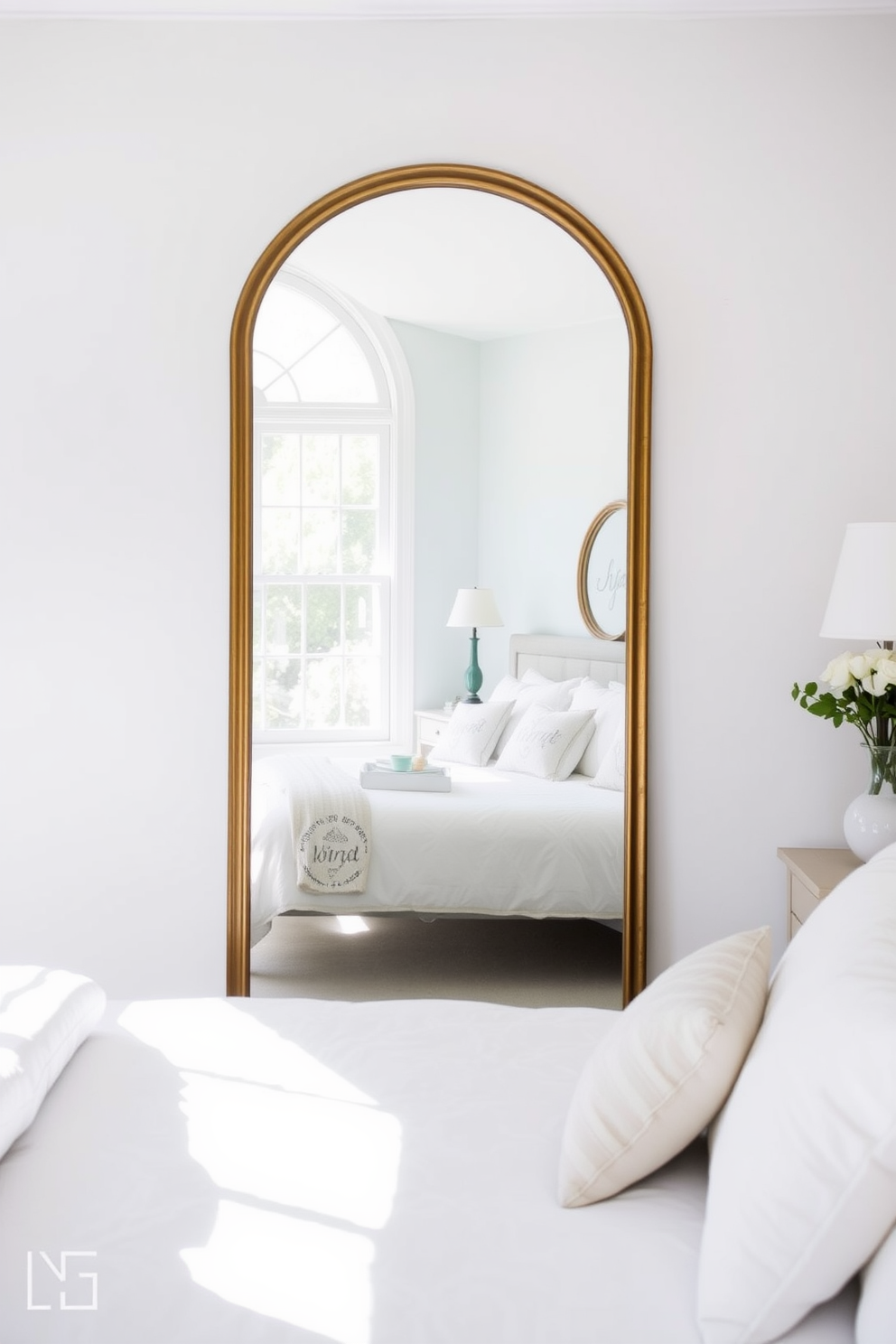 A serene summer bedroom with a large mirror positioned opposite a window to reflect natural light. The walls are painted in a soft pastel color, and the bedding features light, airy fabrics in shades of white and light blue.