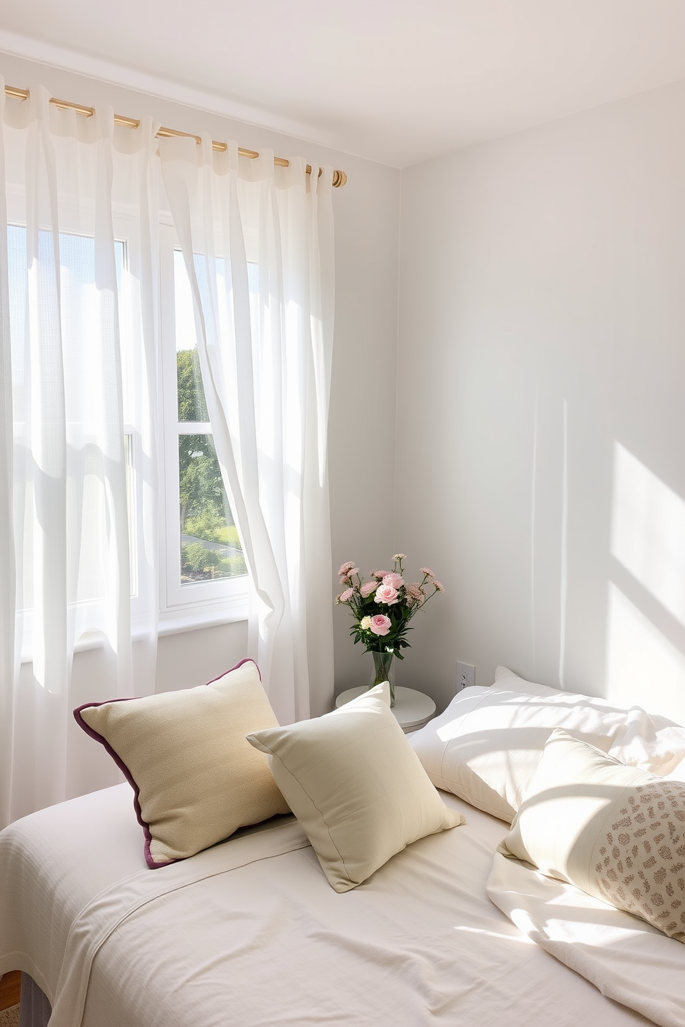 A bright summer bedroom filled with natural light. Lightweight white curtains flutter gently in the breeze, allowing fresh air to flow through the open window. The bed is dressed in soft pastel linens, complemented by a mix of patterned throw pillows. A small bedside table holds a vase of fresh flowers, bringing a touch of nature indoors.