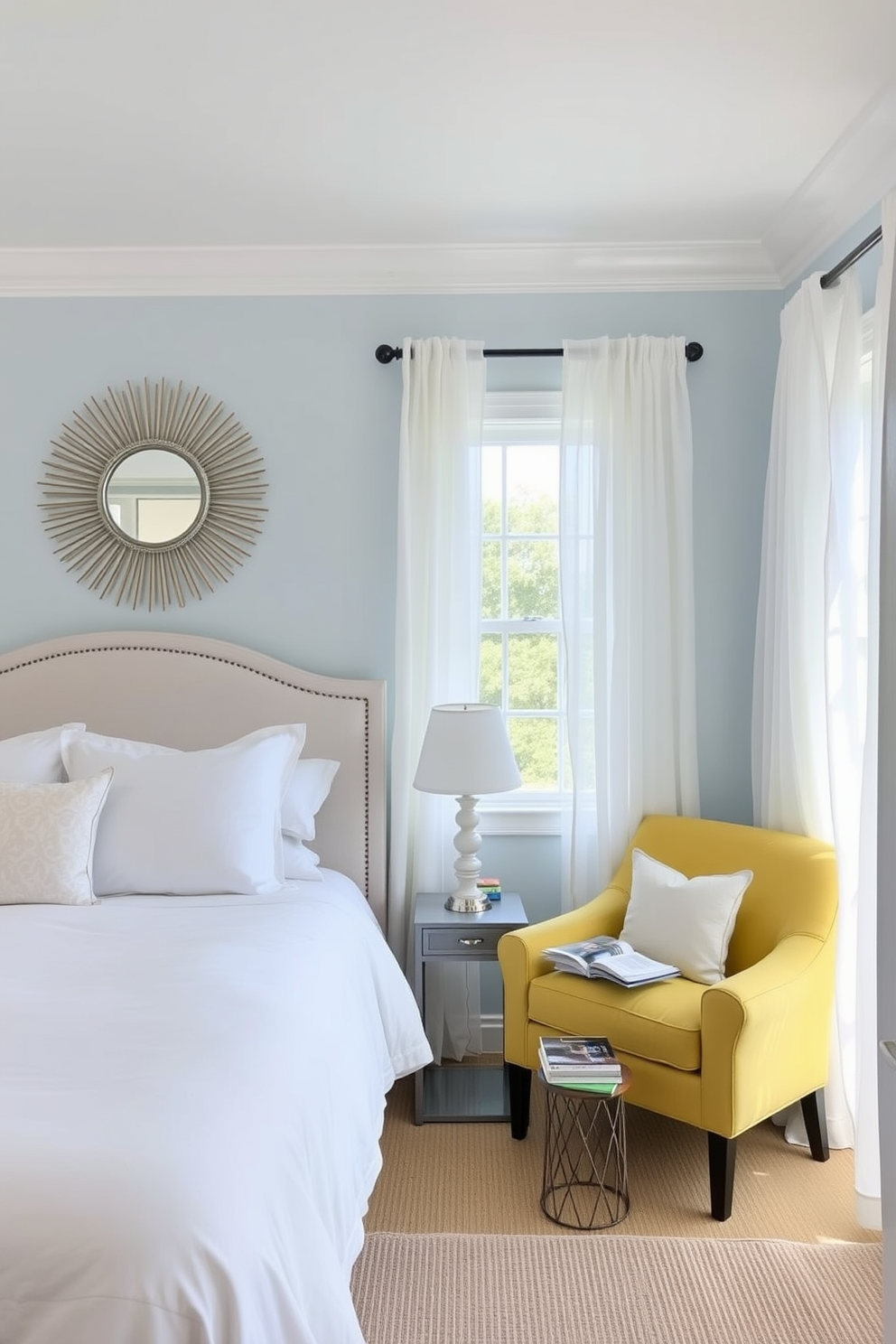 A bright and airy summer bedroom features a soft pastel color palette with light blue walls and crisp white bedding. A sunburst mirror hangs above the headboard, adding a touch of glamour and reflecting natural light throughout the space. The room is adorned with light, breezy curtains that flutter gently in the warm breeze. A cozy reading nook is created with a comfortable armchair in a vibrant yellow hue, paired with a small side table and a stack of summer-themed books.