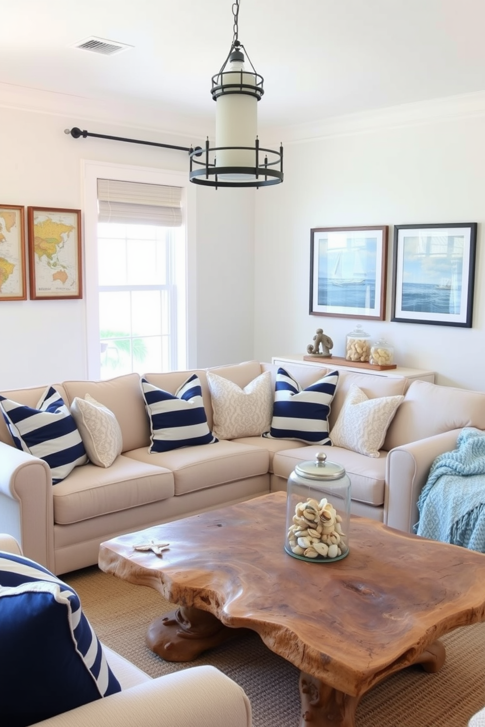 A bright and airy living room featuring nautical decor elements. There are navy blue and white striped throw pillows on a light beige sofa, and a large driftwood coffee table sits in the center of the room. On the walls, framed vintage maps of the sea add character, while a collection of seashells is displayed in a glass jar on a shelf. The space is illuminated by a pendant light shaped like a lighthouse, creating a warm and inviting atmosphere.