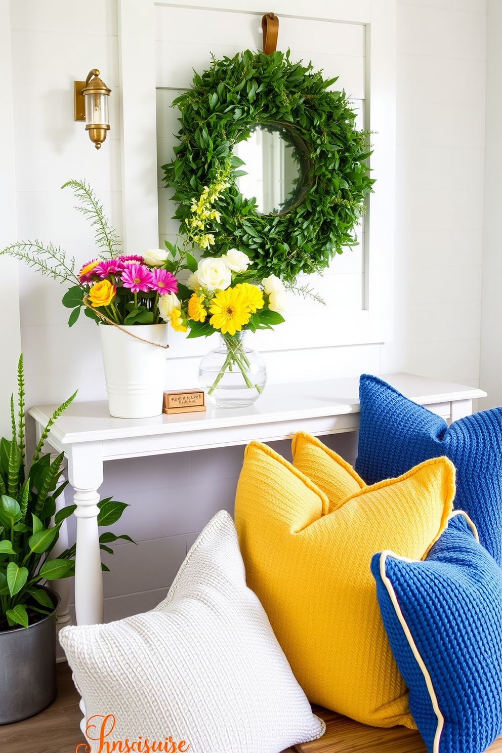 A bright and inviting summer entryway features a stylish console table adorned with a vibrant floral arrangement. Textured cushions in varying shades of blue and yellow are placed on a cozy bench, inviting guests to sit and enjoy the space.