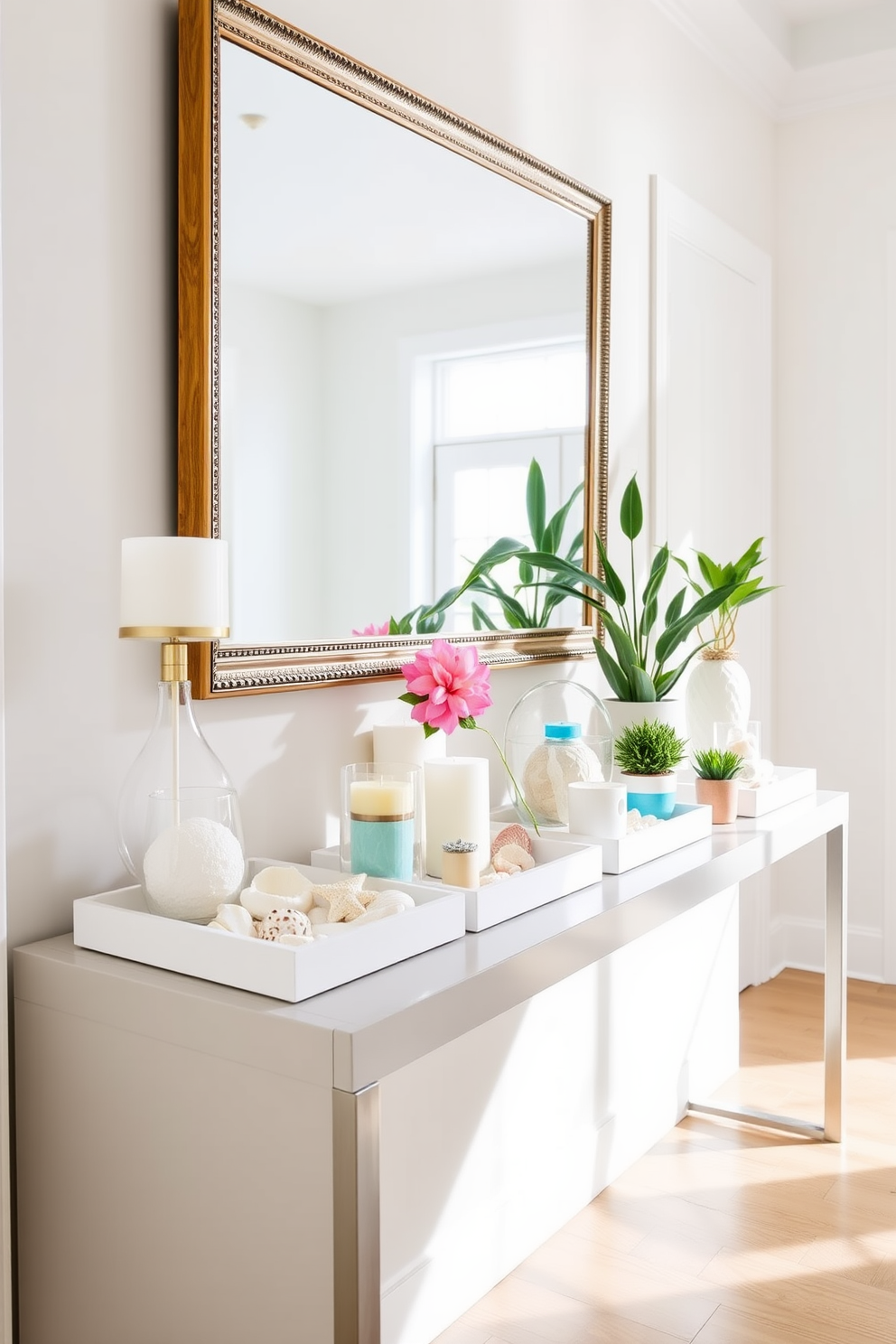 A bright and inviting hallway features a series of decorative trays arranged on a sleek console table. Each tray holds an assortment of vibrant summer-themed decor items, such as seashells, candles, and small potted plants, creating a cheerful and organized atmosphere. The walls are adorned with light pastel colors, enhancing the airy feel of the space. A large mirror above the console reflects natural light, further brightening the hallway while adding a touch of elegance.