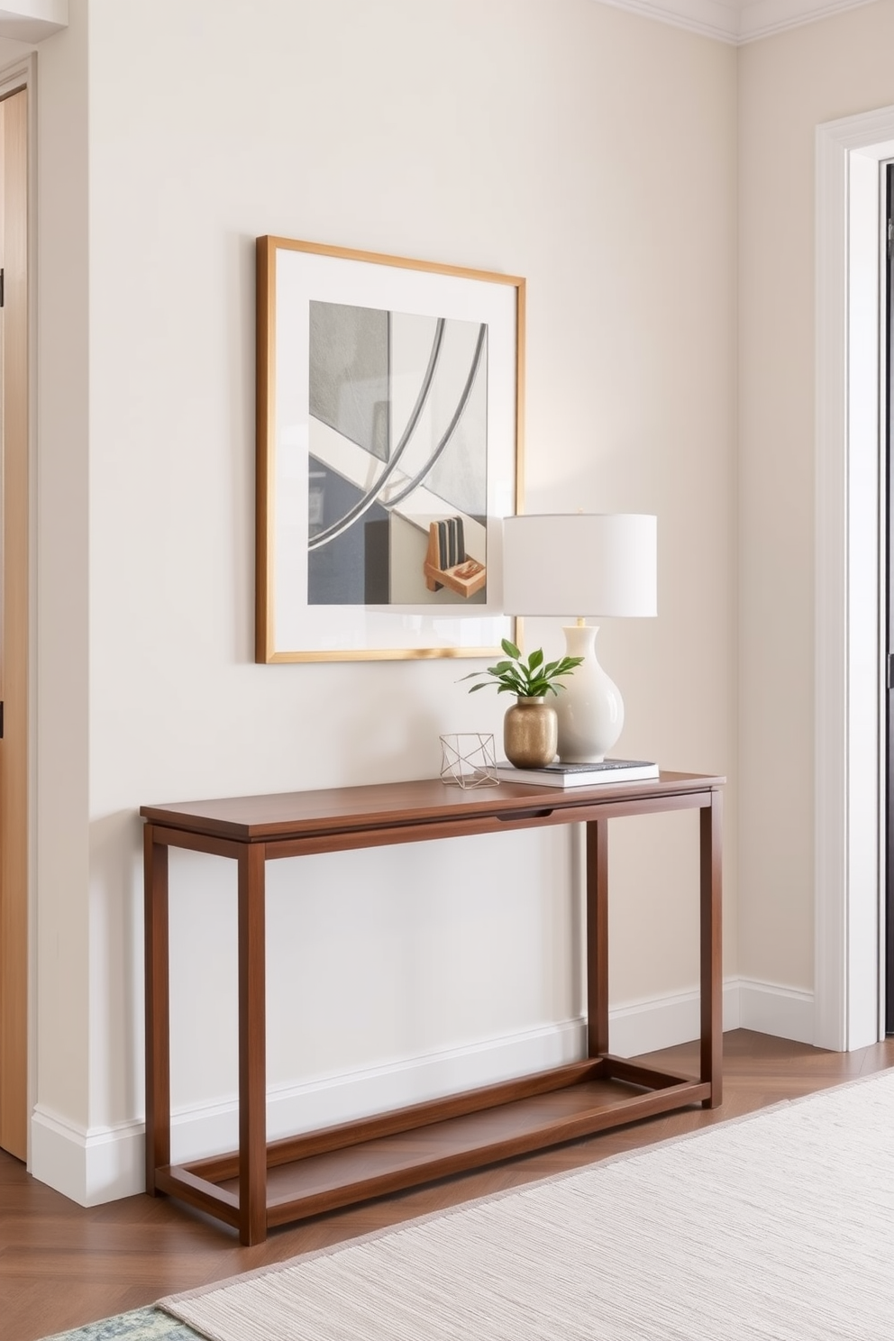 A chic console table is placed against the wall in a bright hallway. It features a sleek design with a wooden finish and is adorned with decorative items such as a stylish lamp and a small potted plant. The hallway is decorated with light-colored walls and a runner rug that adds warmth. Framed artwork hangs above the console table, enhancing the space's elegance and inviting atmosphere.