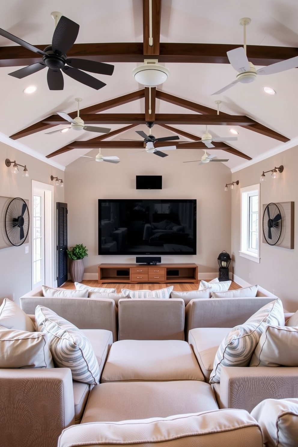 A cozy summer home theater featuring wall-mounted fans to create a breezy atmosphere. The room is adorned with plush seating arranged in a semi-circle, with soft throw pillows and a large screen set against a backdrop of light-colored walls.