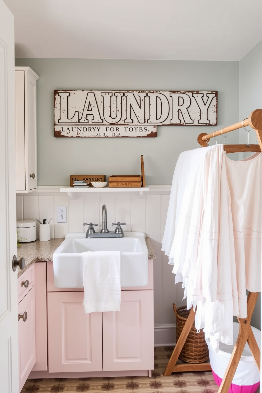 A charming laundry room featuring a vintage laundry sign prominently displayed on the wall. The space is adorned with pastel-colored cabinets, a farmhouse sink, and a rustic wooden drying rack filled with freshly laundered linens.