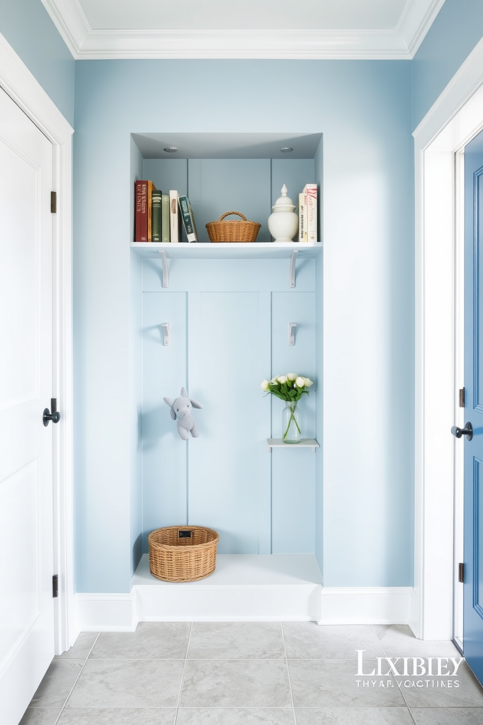 A bright and airy mudroom features a small shelf adorned with neatly arranged books and decorative items. The walls are painted in a soft blue hue, and the floor is covered with light gray tiles for a clean, welcoming look.