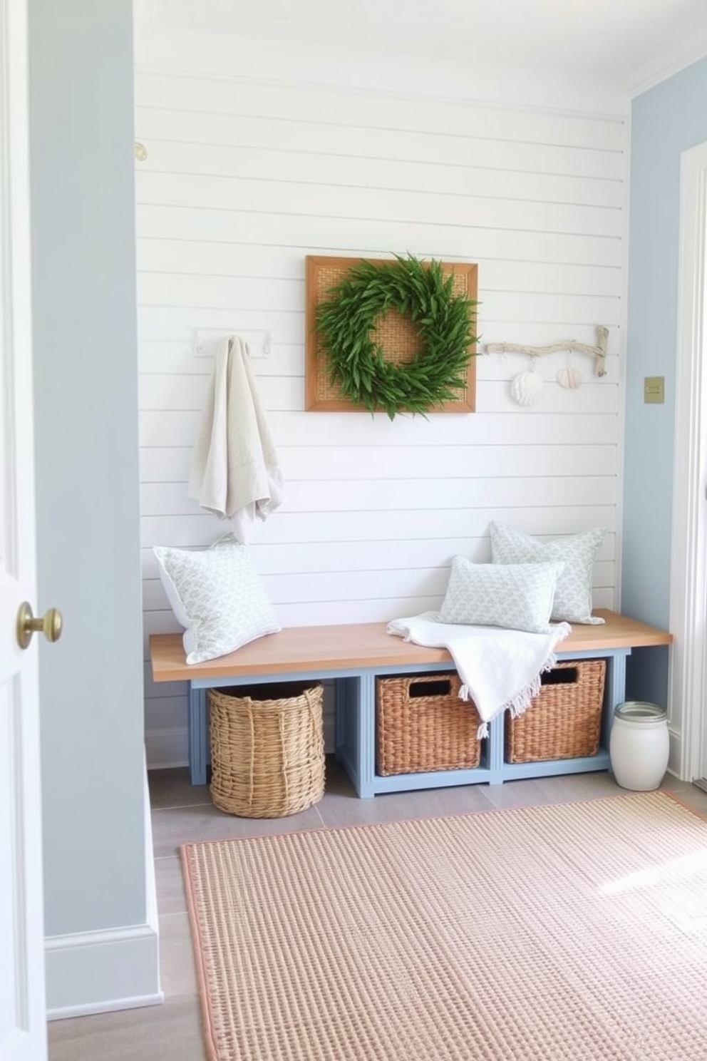 A summer mudroom decorated with soft ocean hues creates a refreshing and inviting atmosphere. Light blue walls complement white shiplap accents, while a natural wood bench provides a functional seating area. Incorporate woven baskets for storage and a large area rug in sandy tones to enhance comfort. Add cheerful coastal decor such as seashells and driftwood accents to complete the look.