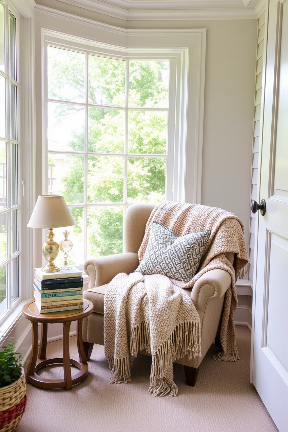 A cozy summer reading nook adorned with soft throws draped over a plush armchair and a small side table. A large window allows natural light to flood the space, highlighting a stack of books and a decorative lamp beside the chair.