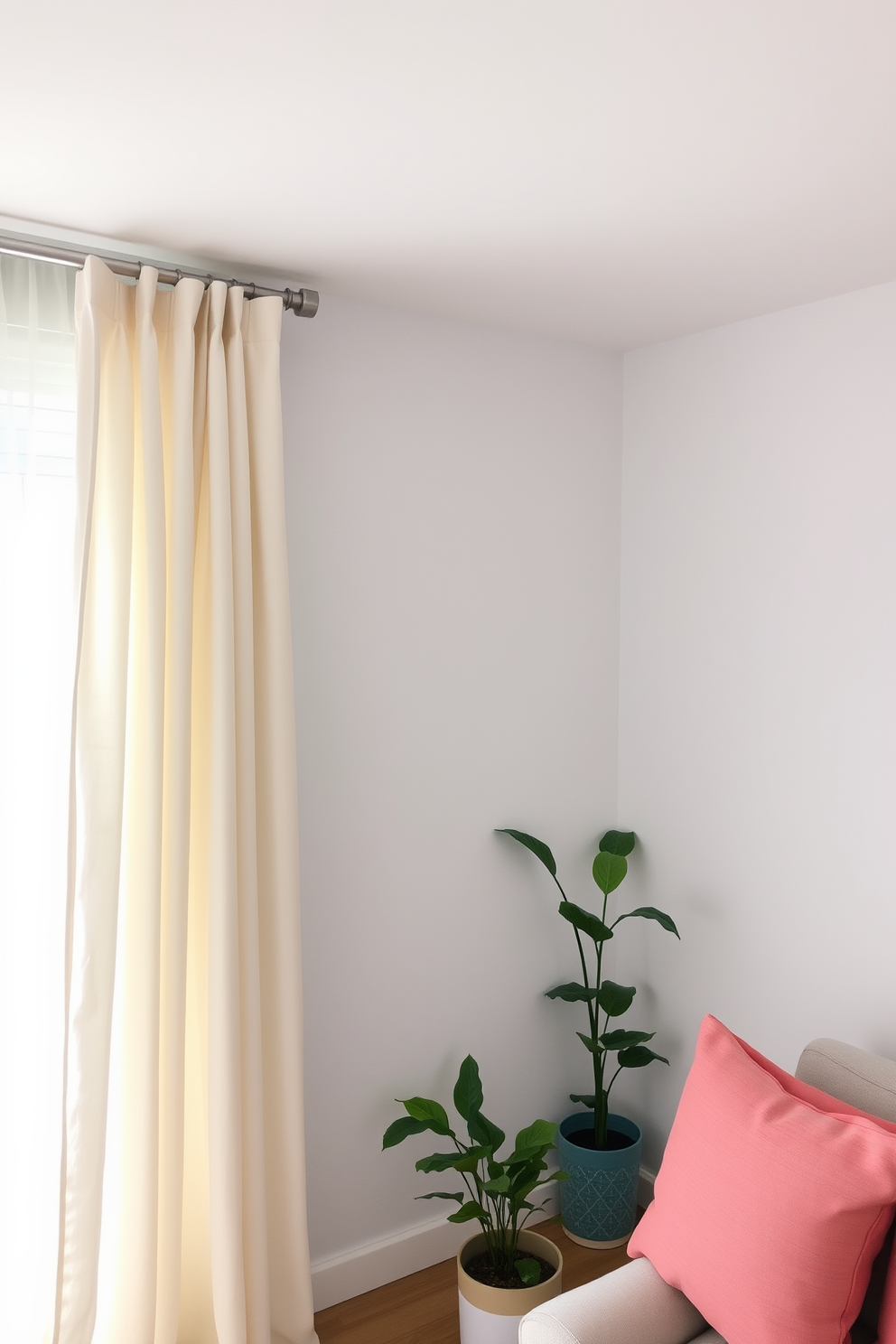 Lightweight cotton curtains drape softly from a sleek curtain rod, allowing natural light to filter through and create an airy atmosphere. The curtains are in a soft pastel color that complements the room's decor, enhancing the sense of openness and tranquility. In the small living space, a minimalist approach is taken with furniture that is both functional and stylish. Bright accent pillows and a few strategically placed plants bring life to the area, making it feel inviting and fresh for the summer season.