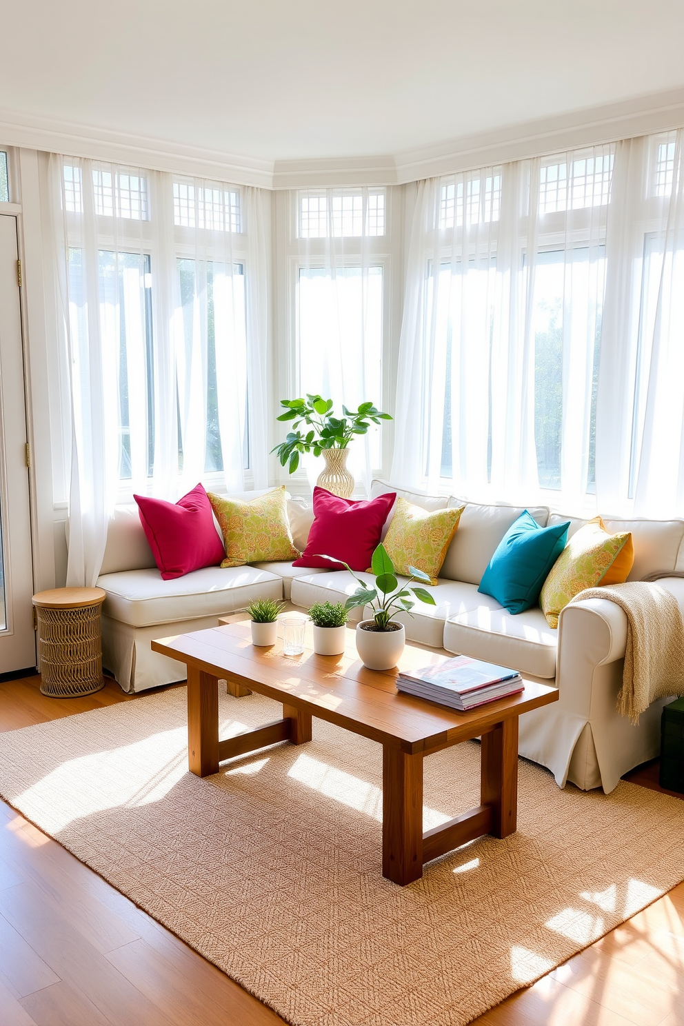 A bright and airy sunroom filled with natural light. The space features large windows adorned with sheer white curtains, allowing the sun to flood in. A comfortable seating area is arranged with a plush sofa covered in light fabric. Colorful throw pillows in vibrant hues are scattered across the sofa, complemented by a cozy blanket draped over the armrest. A wooden coffee table sits in the center, showcasing a few potted plants and a stack of magazines. The floor is covered with a soft area rug that adds warmth and texture to the room.