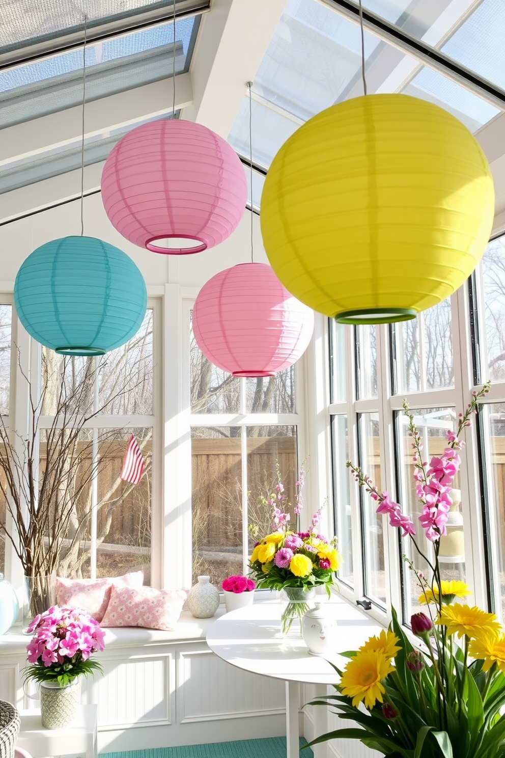 A sunroom filled with natural light features hanging paper lanterns in vibrant spring colors. The space is adorned with pastel decorations and cheerful floral arrangements, creating a festive atmosphere for Easter celebrations.