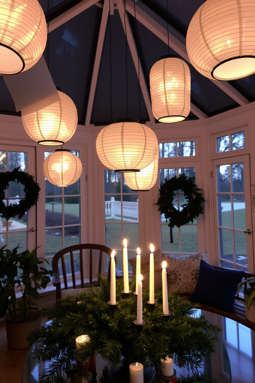 A cozy sunroom adorned for Hanukkah features a lighted display of beautifully wrapped gifts in various sizes and colors. The atmosphere is enhanced by soft, warm lighting that creates a festive and inviting ambiance. Decorative dreidels and menorahs are tastefully arranged on the windowsills, surrounded by lush green plants. The space is filled with cheerful blue and silver accents, reflecting the spirit of the holiday.