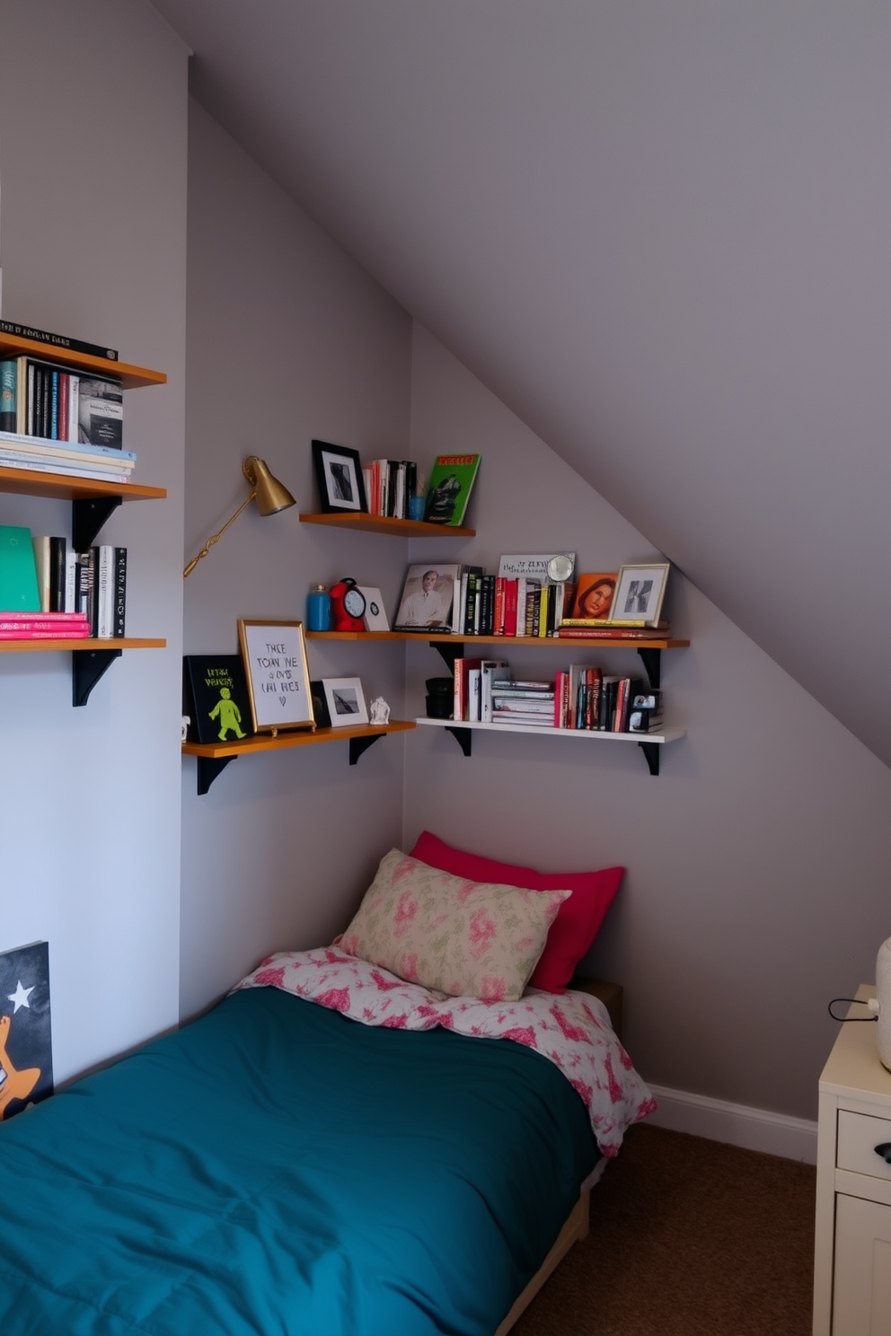 A cozy teenager's attic room features wall-mounted shelves filled with books and decorative items, creating a personalized and inviting space. The walls are painted in a soft gray, while a comfortable bed with colorful bedding is positioned under the sloped ceiling, maximizing the room's charm.