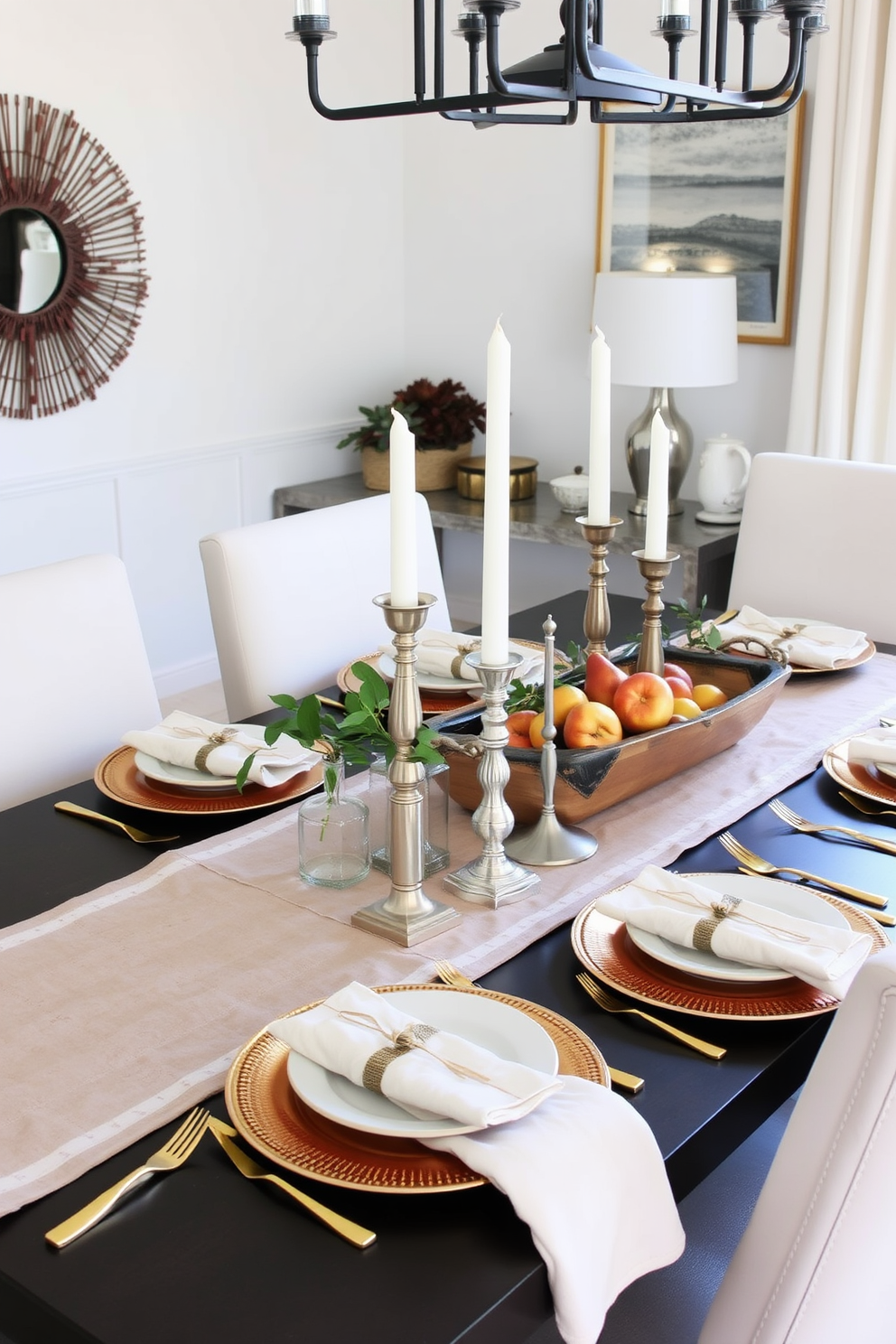 A modern dining room decorated for Thanksgiving featuring mixed metal accents. The table is set with a combination of gold and silver flatware, and the centerpiece includes a mix of metallic candle holders and a rustic wooden tray with seasonal fruits.