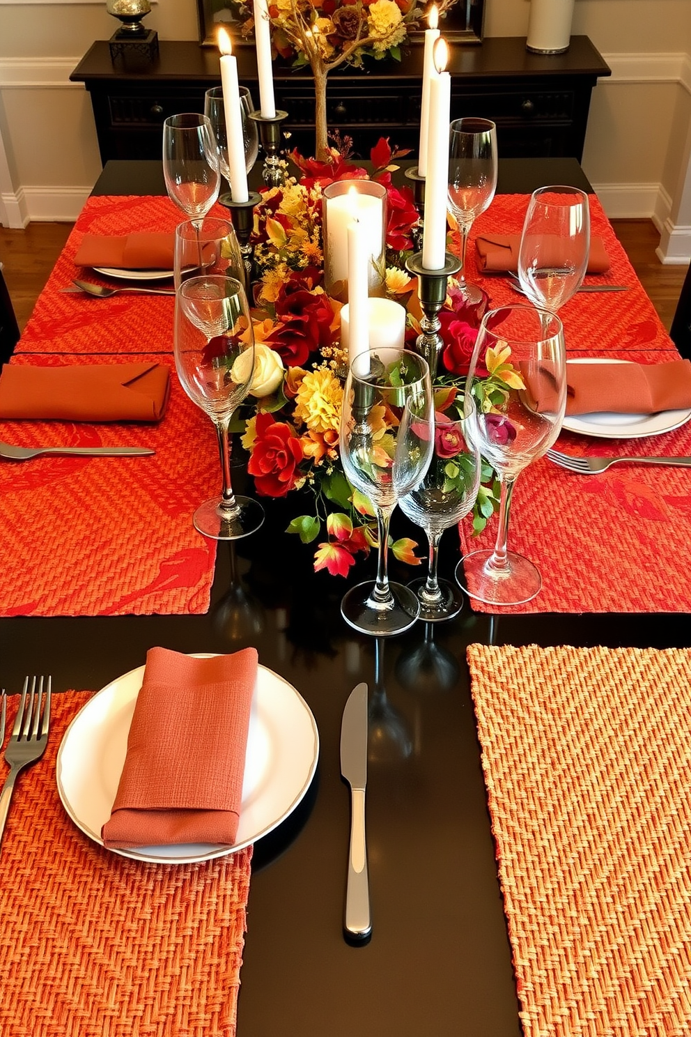 Textured placemats in warm autumn colors lay across a beautifully set dining table. The table is adorned with elegant dinnerware, sparkling glassware, and a centerpiece of seasonal flowers and candles.