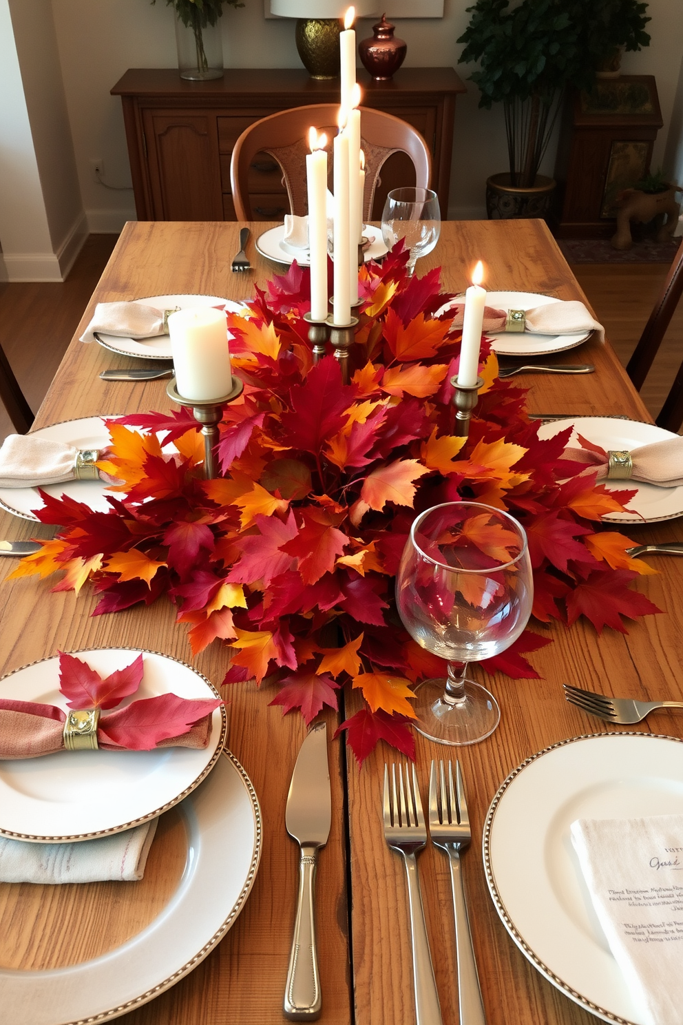 A beautifully set dining table adorned with vibrant fall leaves in rich reds, oranges, and yellows. The table features a rustic wooden surface, complemented by elegant dinnerware and flickering candles that create a warm, inviting atmosphere.