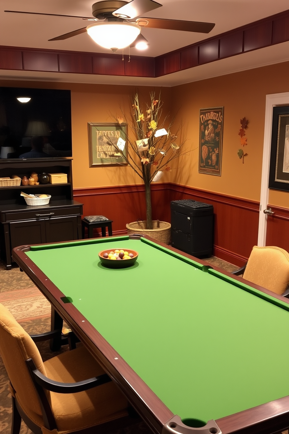 Create a cozy game room setting designed for Thanksgiving gatherings. There are decorative baskets filled with seasonal table games placed around a large wooden table surrounded by comfortable chairs. The walls are adorned with autumn-themed decorations featuring warm colors like orange and gold. Soft lighting from overhead fixtures casts a warm glow, enhancing the inviting atmosphere for family and friends to enjoy.