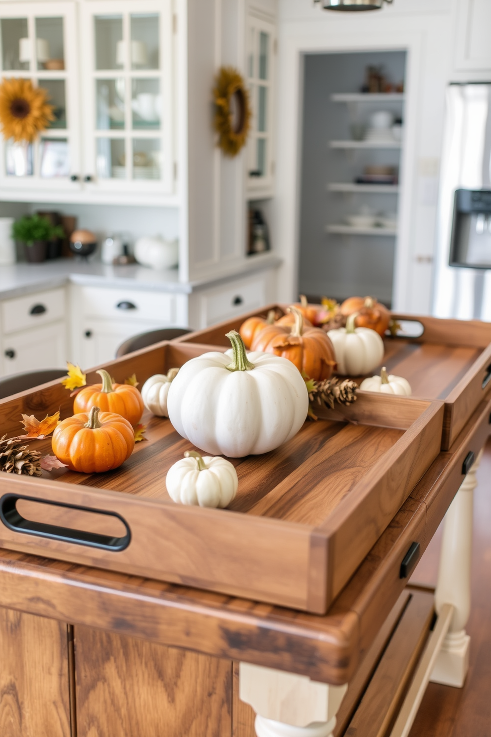 Rustic wooden serving trays are arranged on a farmhouse-style kitchen island. The trays are adorned with seasonal decorations, including small pumpkins and autumn leaves, creating a warm and inviting atmosphere for Thanksgiving.