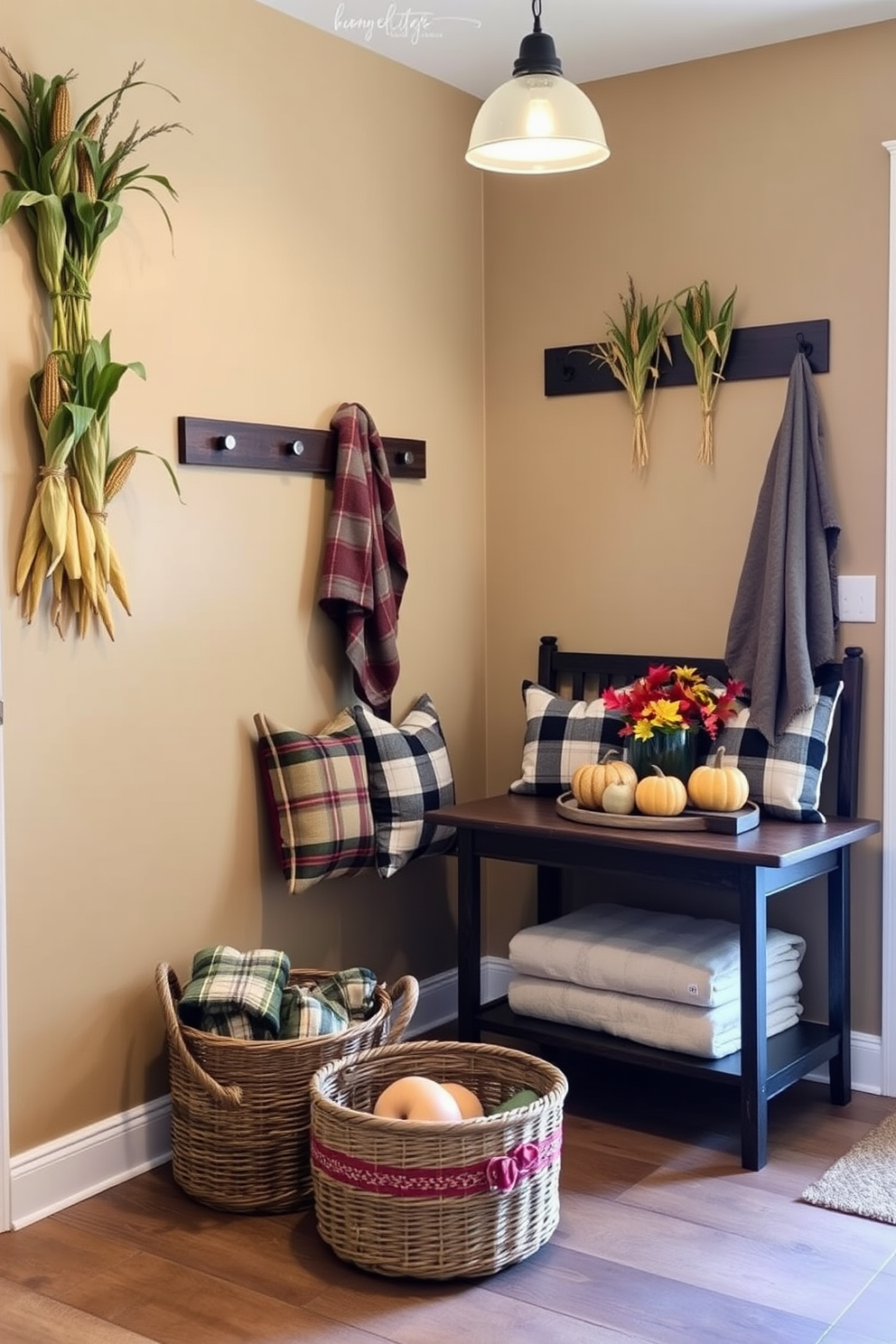 A cozy mudroom adorned with miniature corn stalks as decor for Thanksgiving. The walls are painted in a warm beige tone, and a rustic bench with plaid cushions sits against the wall. On the floor, a woven basket holds extra blankets, while a small table displays a festive arrangement of pumpkins and autumn leaves. The space is illuminated by soft pendant lighting, creating an inviting atmosphere for guests.