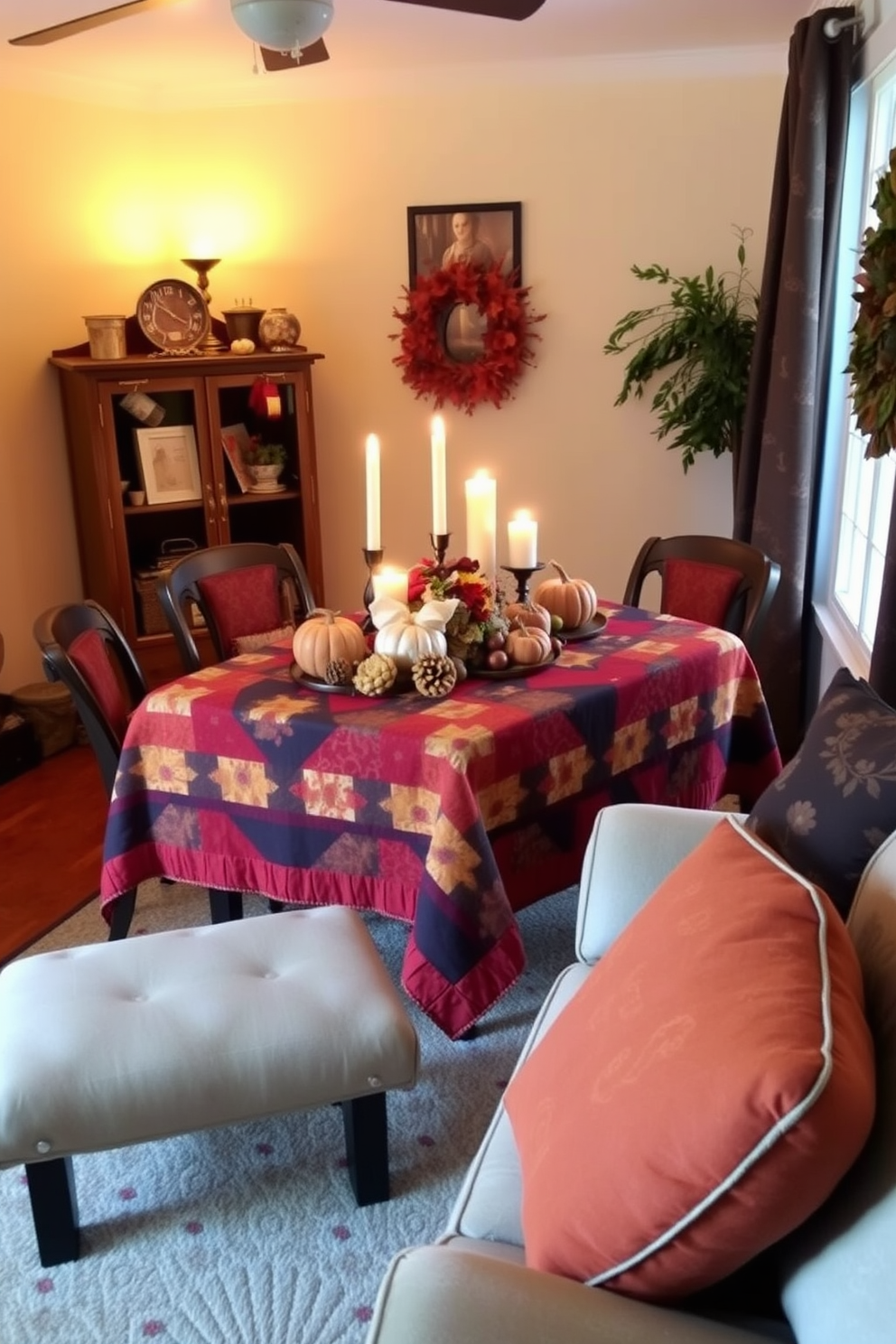 A cozy small living room adorned with a quilted tablecloth in rich autumn colors. The table is set with seasonal decorations including pumpkins and candles, creating a warm and inviting atmosphere.