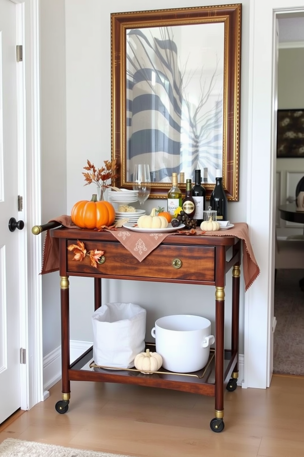 A stylish cart serves as an extra serving space for Thanksgiving, adorned with seasonal decorations like pumpkins and autumn leaves. The cart features a rich wood finish, complemented by elegant gold accents, and is topped with a festive tablecloth for an inviting touch. In a cozy small space, the cart is strategically placed near the dining area to maximize functionality. It holds an assortment of dishes, drinks, and decorative items, creating a warm and welcoming atmosphere for guests.