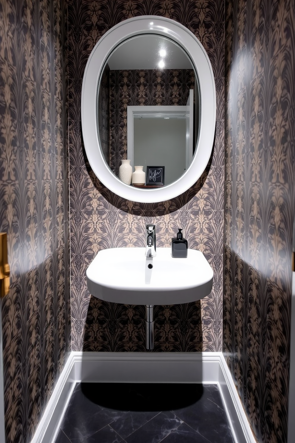 A compact sink with a sleek, modern faucet is the focal point of this tiny powder room. The walls are adorned with a bold wallpaper pattern, and the floor features elegant, dark tiles that create a striking contrast. A round mirror with a minimalist frame hangs above the sink, reflecting the stylish elements of the space. A small shelf holds decorative items, adding personality to the room while maximizing functionality.