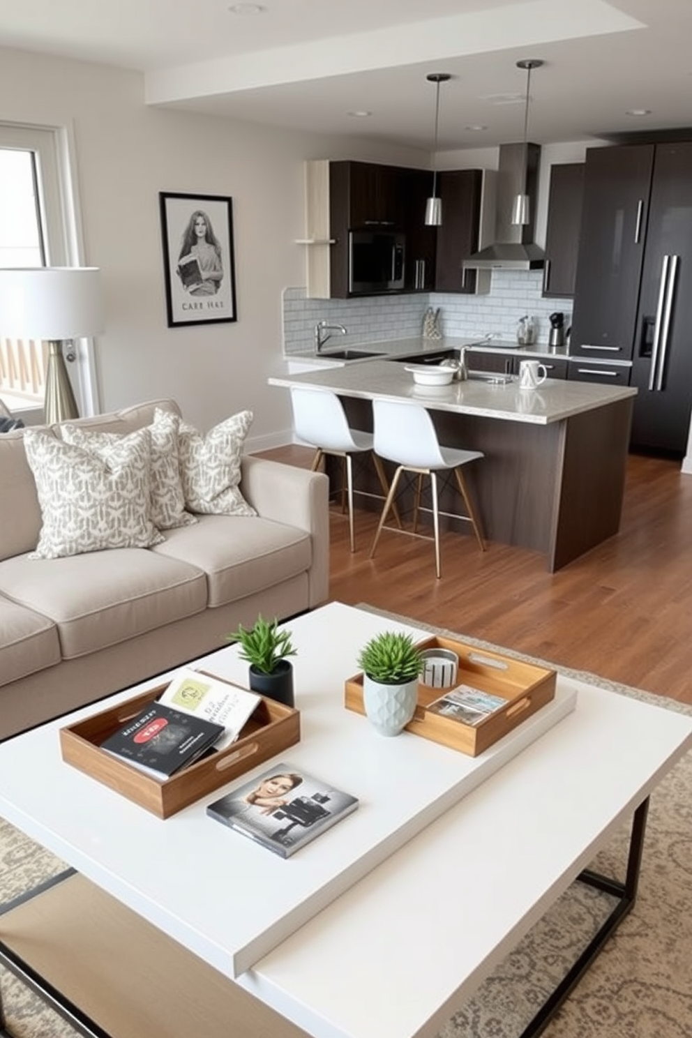 A stylish townhouse apartment featuring a cozy living area with a plush sectional sofa arranged around a sleek coffee table. Decorative trays are placed on the table, holding magazines and a small potted plant for an organized and inviting surface. The open-concept kitchen boasts modern cabinetry and a spacious island with bar stools. Decorative trays on the countertop showcase essential kitchen items, enhancing both functionality and aesthetic appeal.