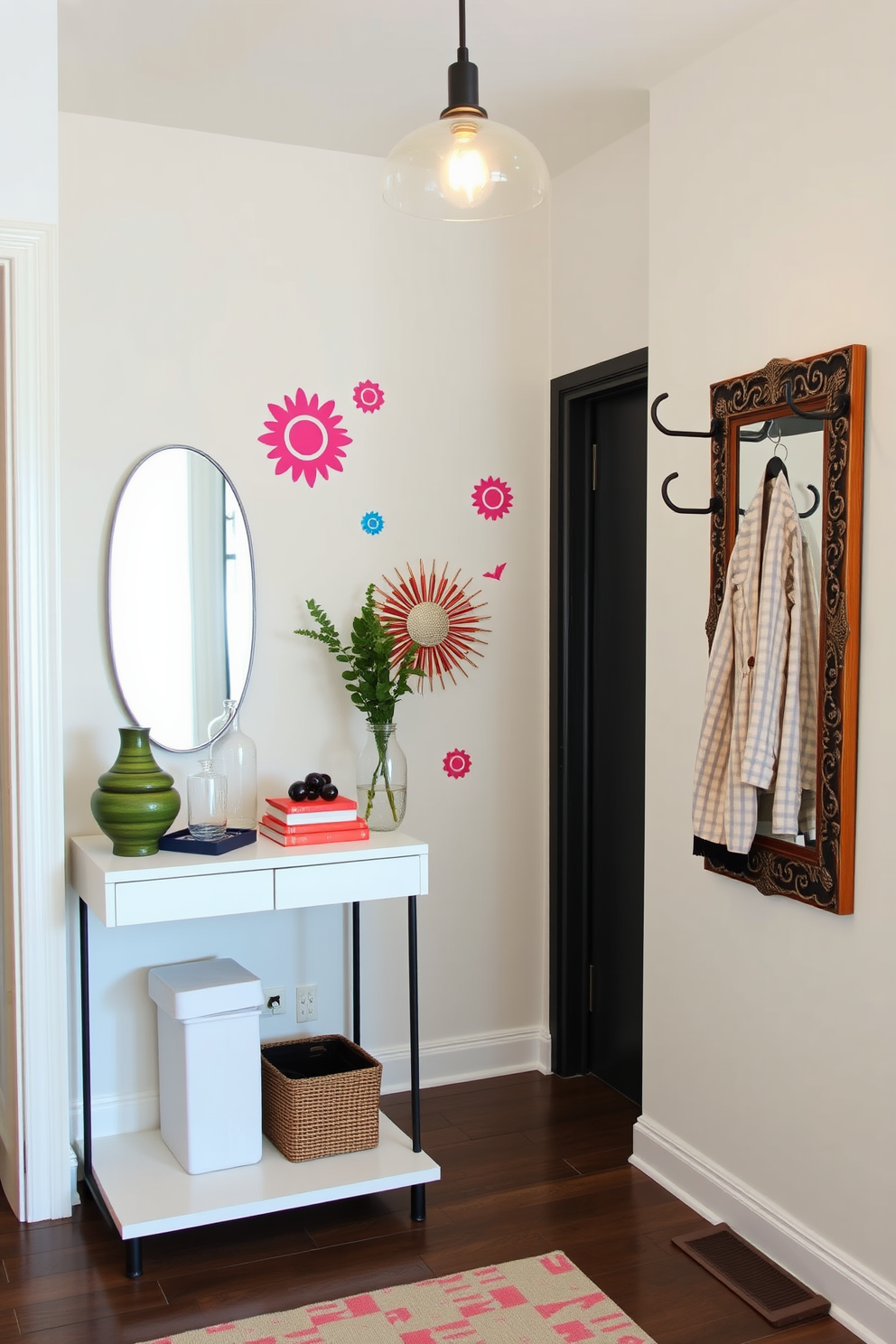 Chic wall decals in vibrant colors adorn the entryway walls, creating a lively and inviting atmosphere. A sleek console table sits against one wall, topped with decorative items and a stylish mirror that reflects the space. The entryway features a modern coat rack made of metal, providing functionality without sacrificing style. Soft lighting from a pendant fixture casts a warm glow, enhancing the overall aesthetic of the townhouse.