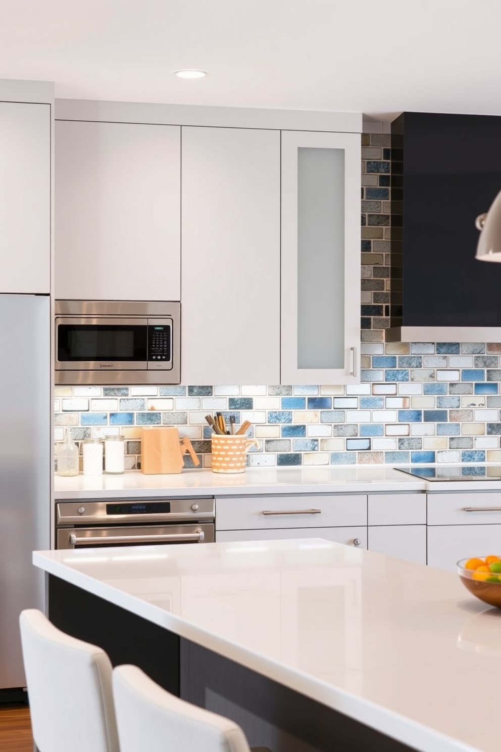 A modern townhouse kitchen featuring a subway tile backsplash accented with colorful grout. The cabinetry is sleek and minimalist, complemented by stainless steel appliances and a large island with bar seating.