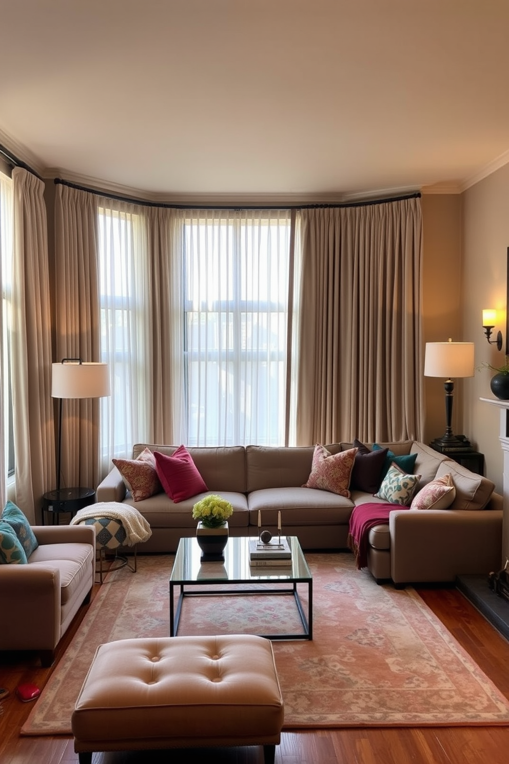 A cozy townhouse living room featuring large windows adorned with soft, flowing curtains that provide both privacy and warmth. The space is filled with a plush sectional sofa in neutral tones, complemented by vibrant throw pillows and a stylish coffee table at the center. The walls are painted in a warm beige, creating an inviting atmosphere, while a statement rug adds texture underfoot. A combination of floor lamps and wall sconces provides ambient lighting, enhancing the room's comfort and elegance.