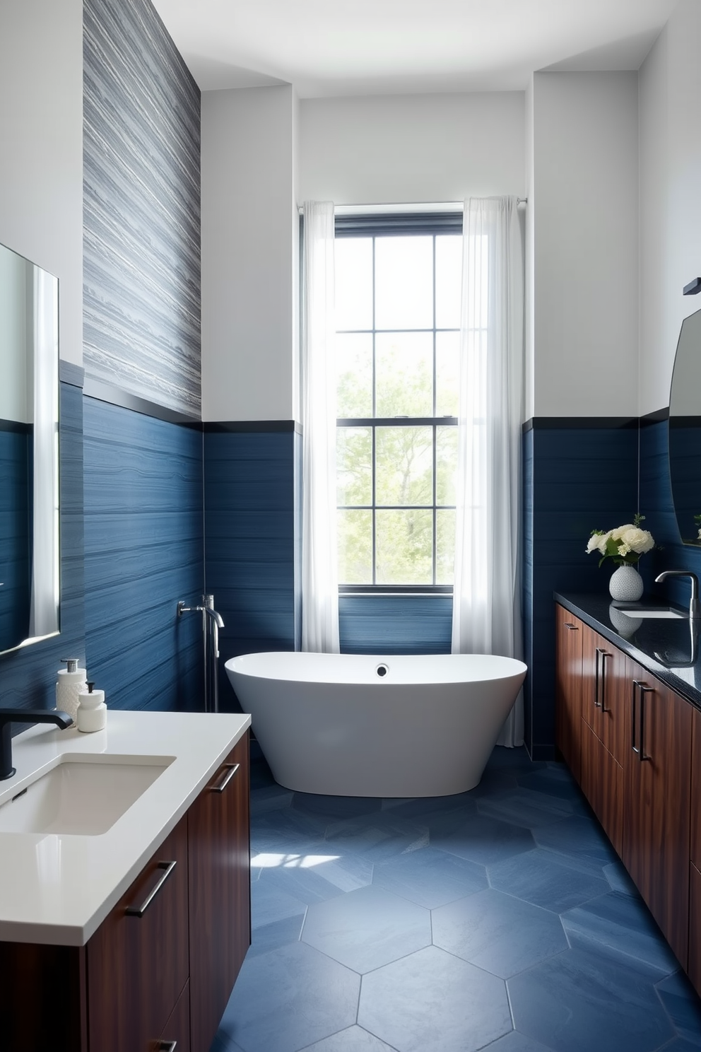 A sleek transitional bathroom featuring sophisticated color blocking with a blend of deep navy blue and soft white tones. The walls are adorned with a textured wallpaper that adds depth, while the cabinetry showcases a rich walnut finish for a warm contrast. A freestanding bathtub sits elegantly in the center, surrounded by stylish geometric tiles in varying shades of blue. Natural light floods the space through a large window dressed with sheer curtains, enhancing the modern appeal of the design.