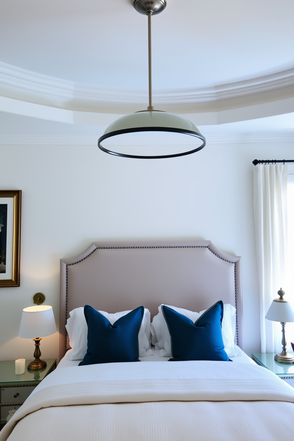 A harmonious blend of sleek and traditional lighting creates an inviting atmosphere in the transitional bedroom. The room features a modern chandelier with clean lines above the bed, complemented by vintage bedside lamps that add warmth and character.