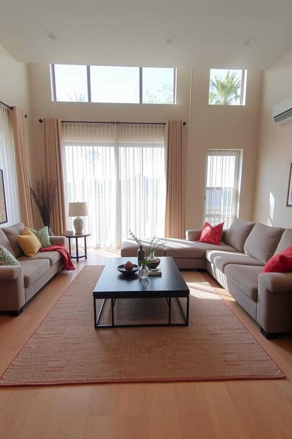 A spacious living room featuring a large coffee table at the center, designed for both functionality and style. The coffee table is surrounded by a comfortable sectional sofa upholstered in a soft gray fabric, complemented by colorful accent pillows. Natural light floods the room through large windows adorned with sheer curtains, creating a warm and inviting atmosphere. The walls are painted in a soft beige, while a textured area rug anchors the seating arrangement, adding a touch of coziness.